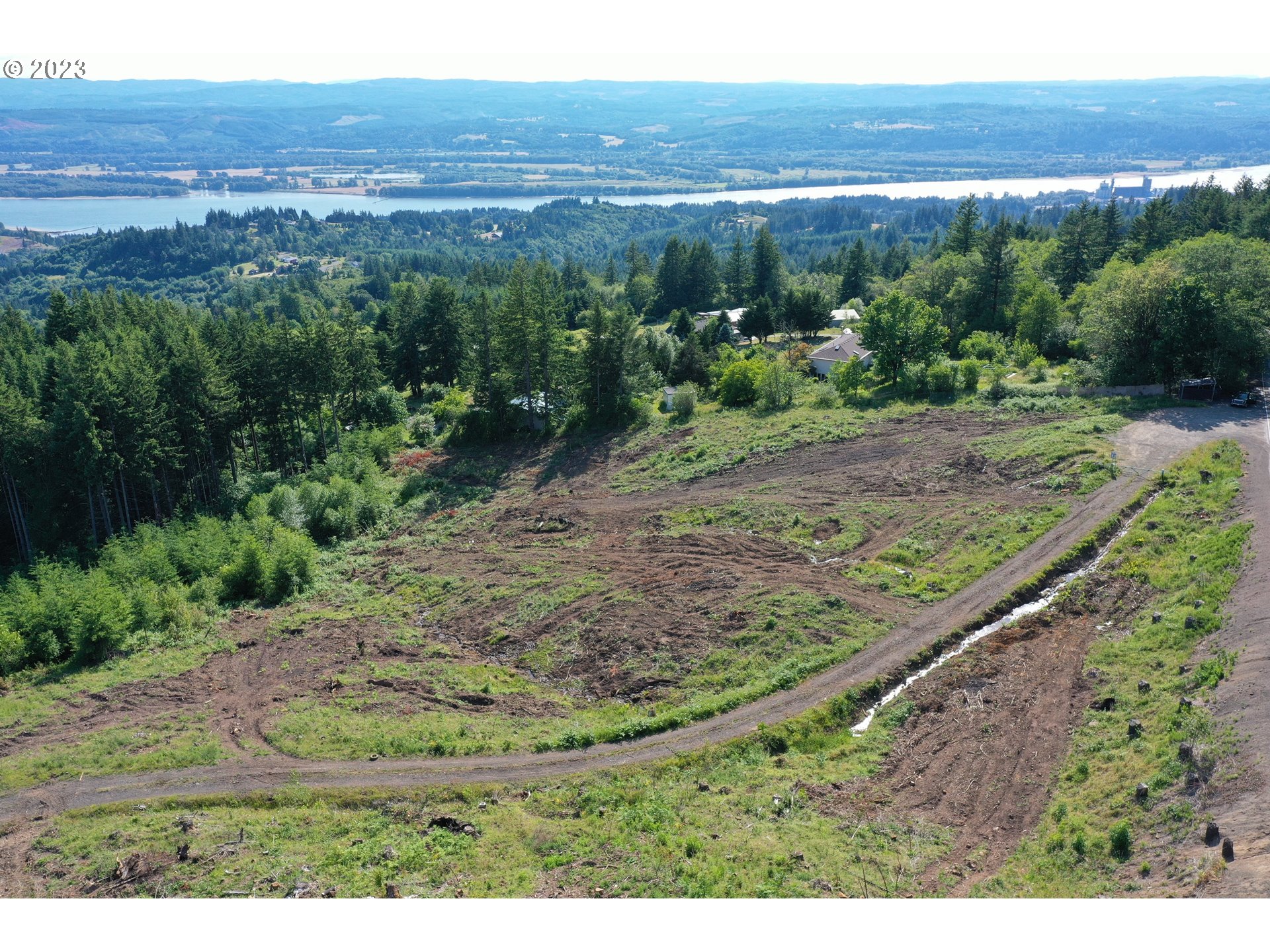 2987 Green Mountain Road, Unit D Kalama, WA 98625 - Photo 2 of 19 a view of a yard with an ocean