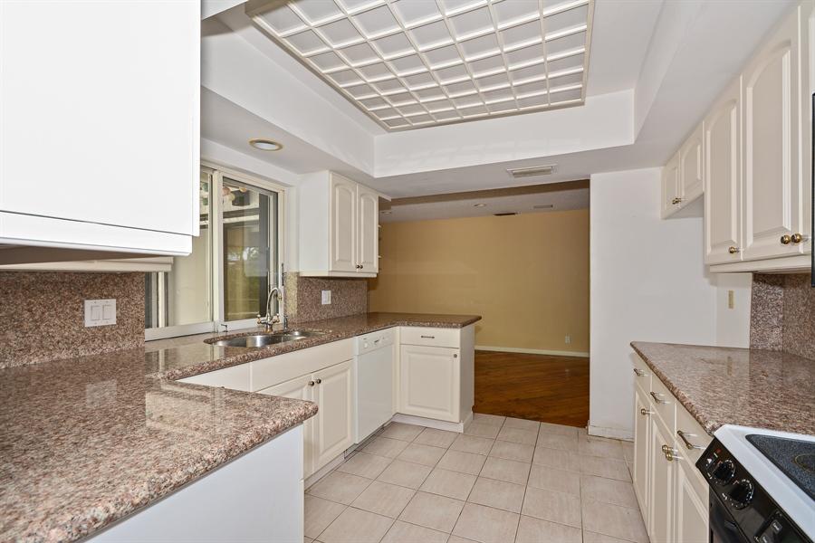 21536 Toledo Road Boca Raton, FL 33433 - Photo 7 of 19 a kitchen with granite countertop a sink and cabinets