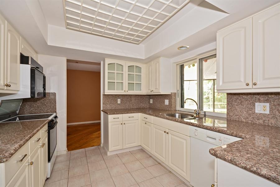 21536 Toledo Road Boca Raton, FL 33433 - Photo 8 of 19 a kitchen with a sink stove and cabinets