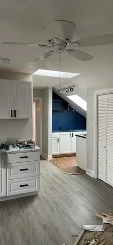 a kitchen with stainless steel appliances a stove and cabinets