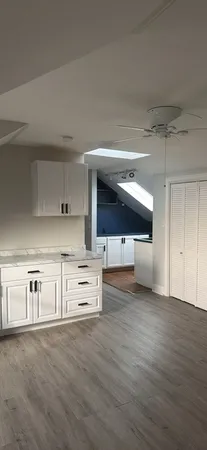 a kitchen with stainless steel appliances a stove and cabinets