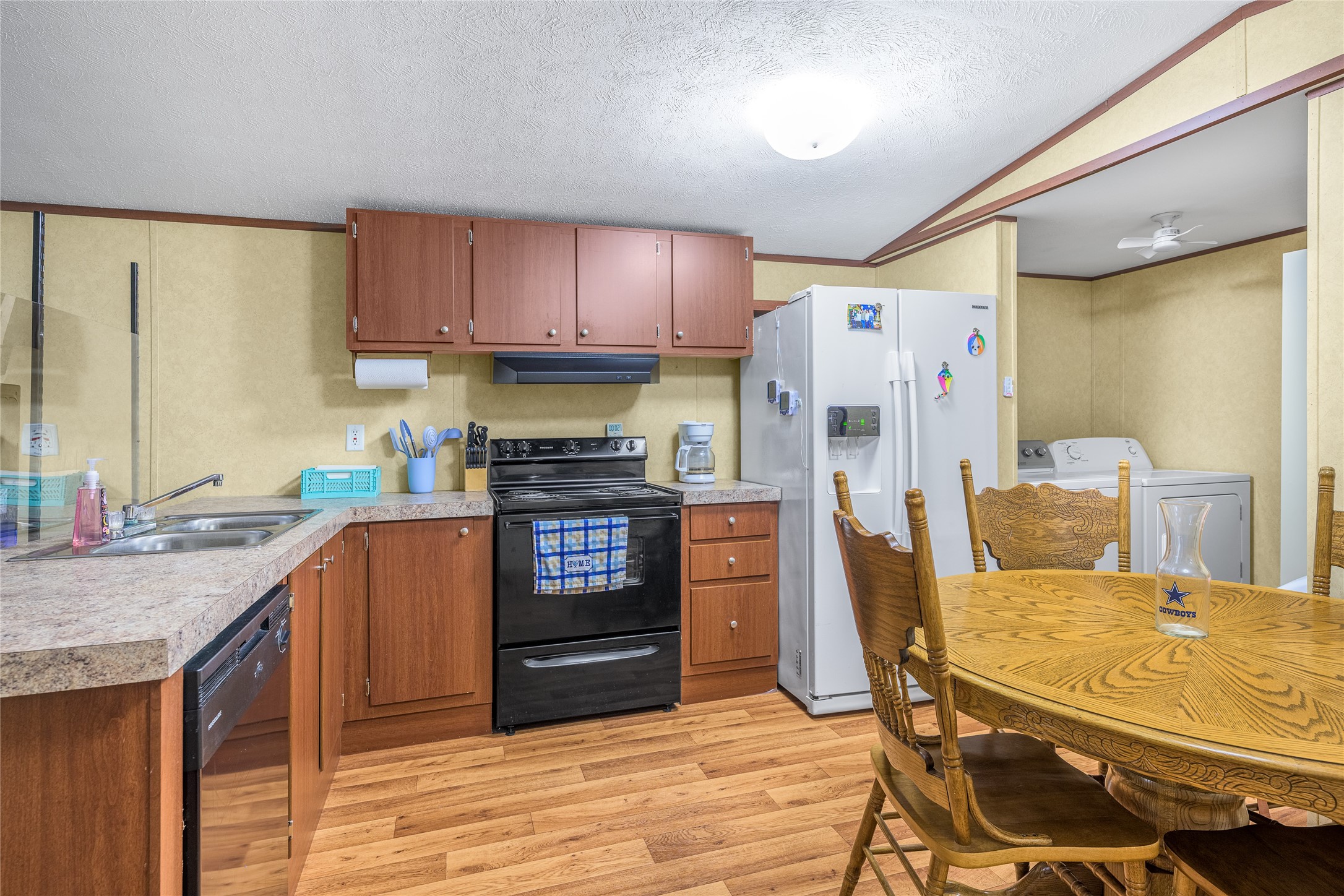 3940 Davis Road West Point, TX 78963 - Photo 11 of 22 a kitchen with stainless steel appliances granite countertop a refrigerator sink and cabinets
