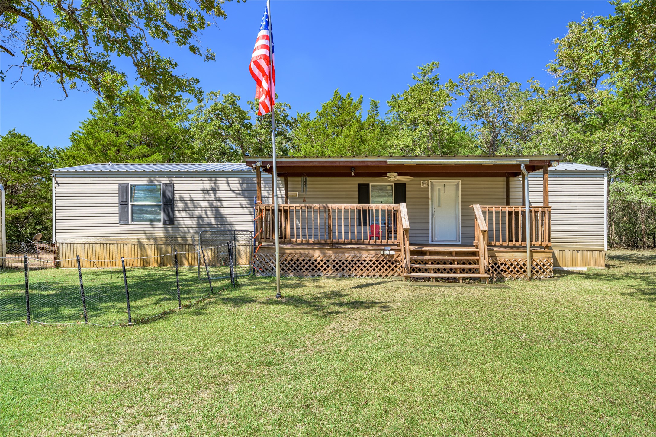 3940 Davis Road West Point, TX 78963 - Photo 3 of 22 a backyard of a house with table and chairs