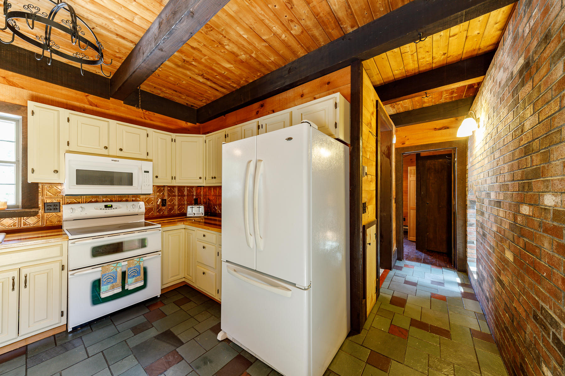 26 Pine Ridge Road East Falmouth, MA 02536 - Photo 12 of 36 a white refrigerator freezer and a stove sitting inside of a kitchen