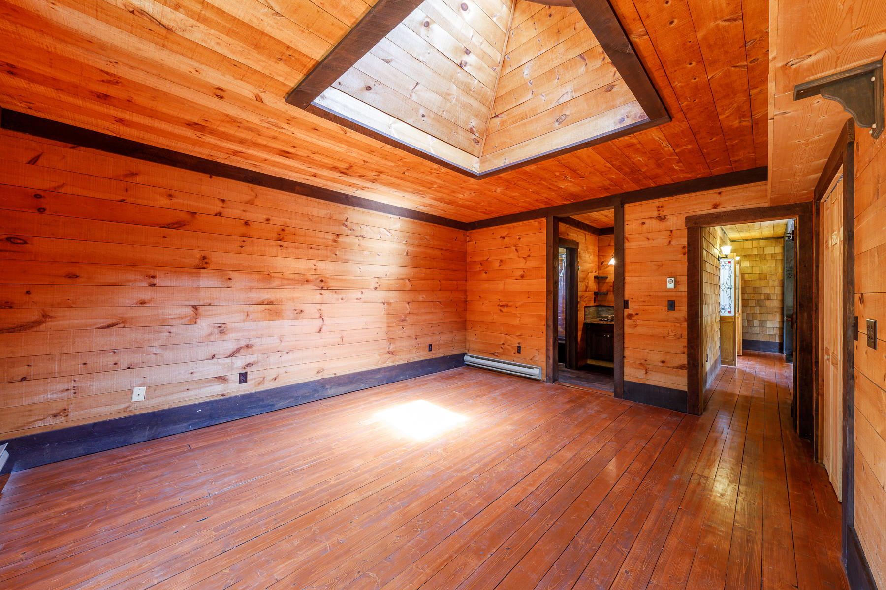 26 Pine Ridge Road East Falmouth, MA 02536 - Photo 22 of 36 a view of an empty room with wooden floor and a window