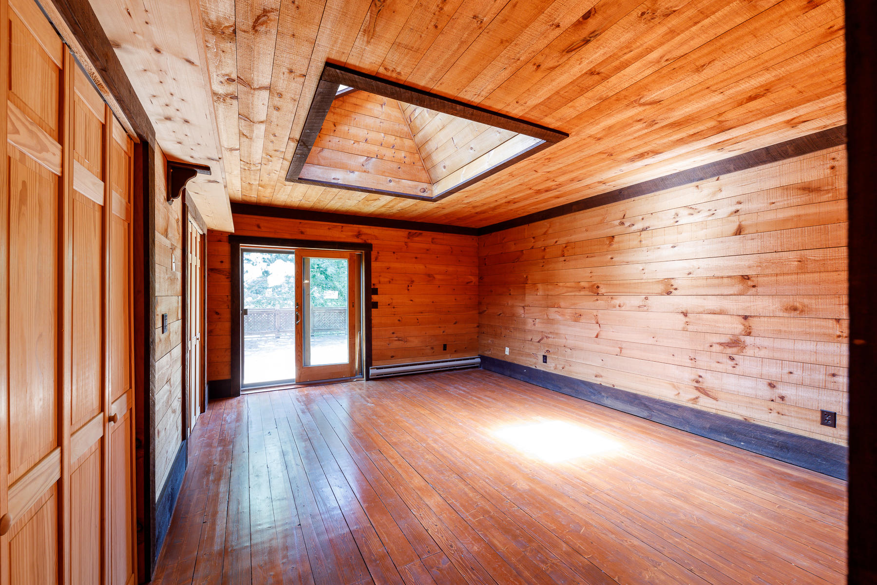 26 Pine Ridge Road East Falmouth, MA 02536 - Photo 24 of 36 a view of an empty room with wooden floor and a window