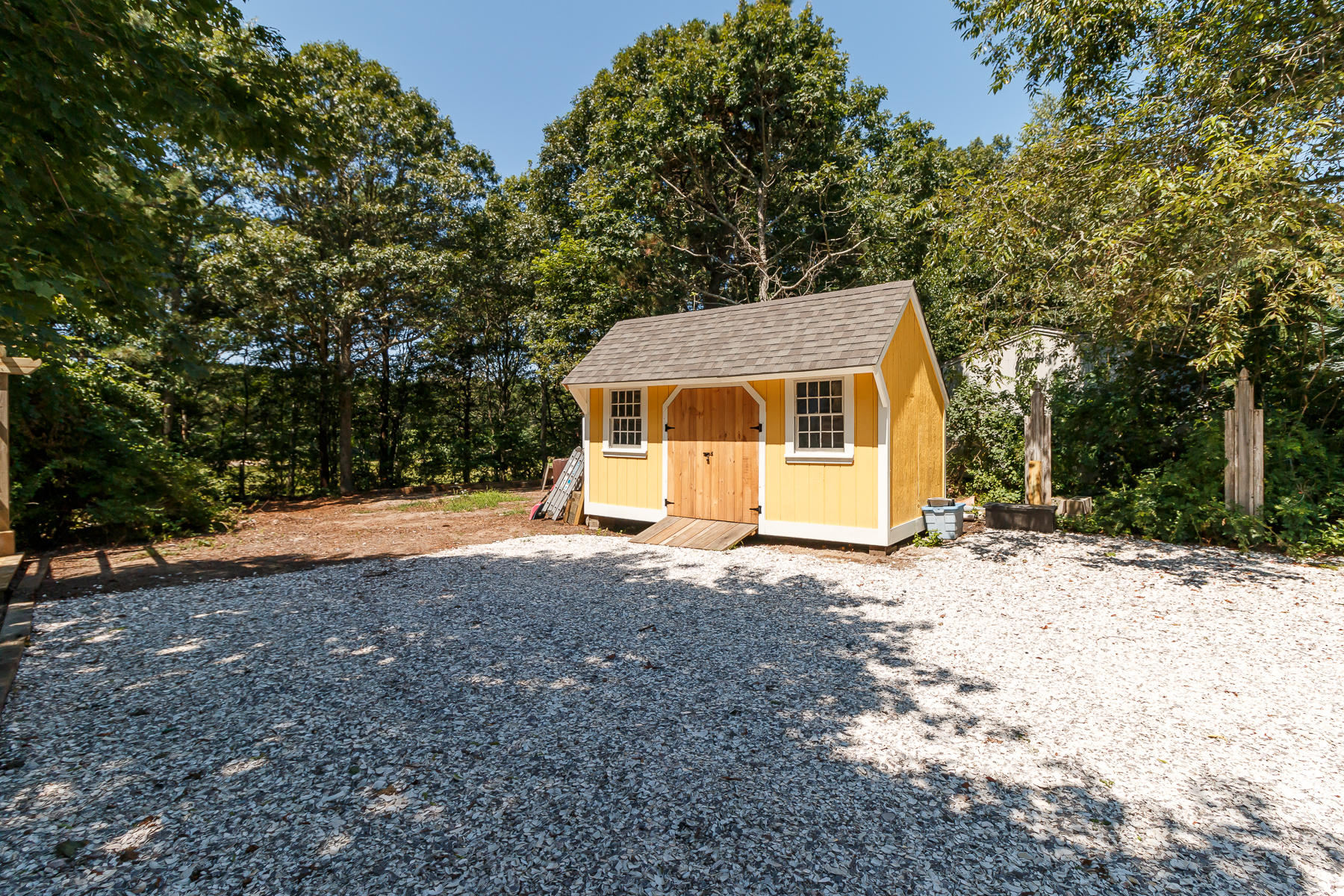 26 Pine Ridge Road East Falmouth, MA 02536 - Photo 31 of 36 a front view of a house with a yard and garage