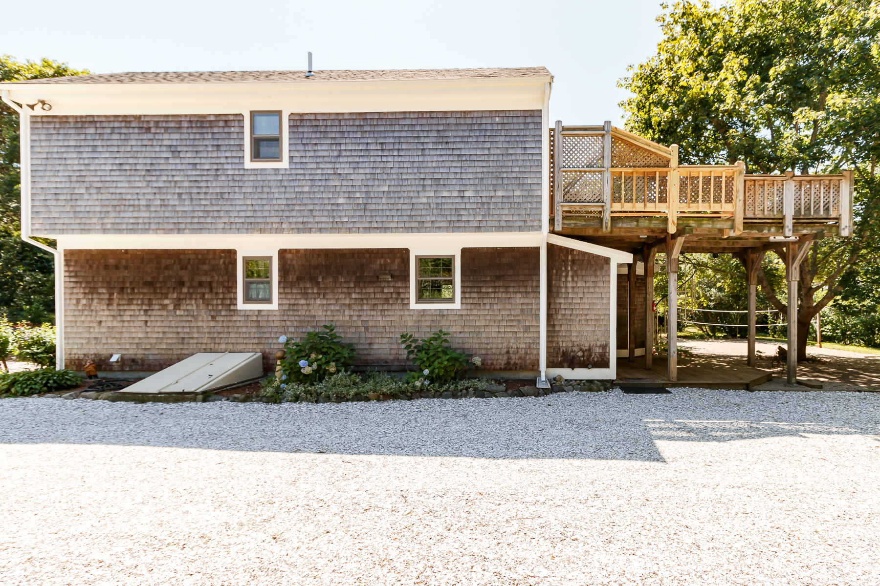 26 Pine Ridge Road East Falmouth, MA 02536 - Photo 33 of 36 a front view of a house with a yard and garage