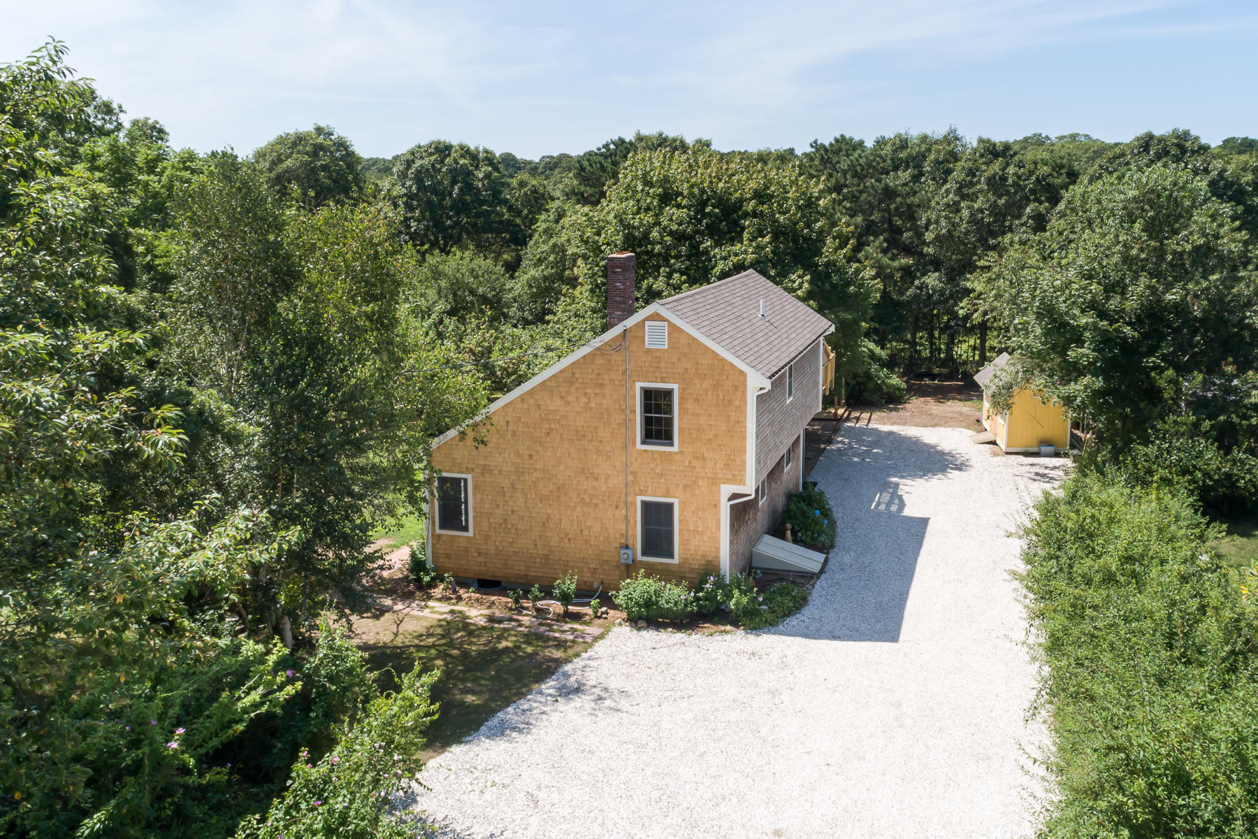 26 Pine Ridge Road East Falmouth, MA 02536 - Photo 34 of 36 a aerial view of a house with yard and trees in the background