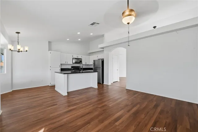 a kitchen with a sink a stove and refrigerator