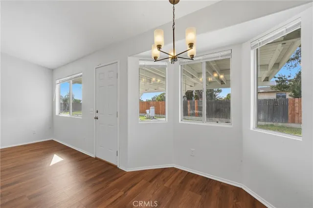 a workspace with furniture and wooden floor