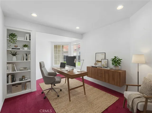 a spacious bedroom with a bed and a couch