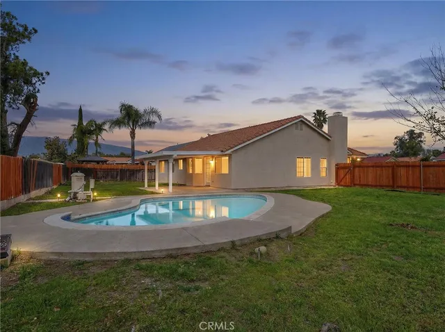 an aerial view of a houses with yard