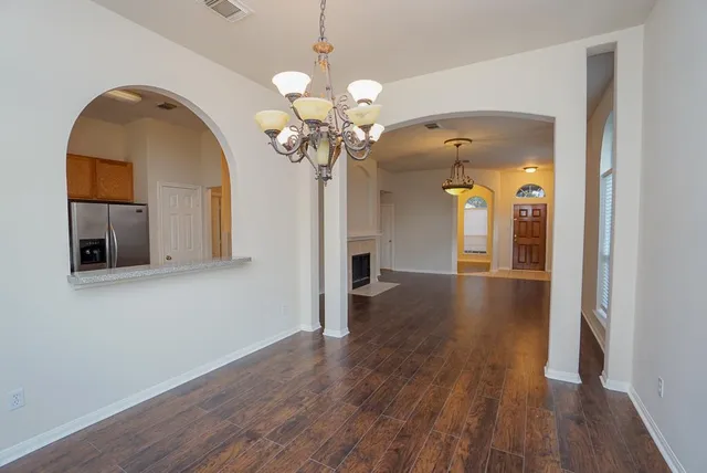 a view of a livingroom with wooden floor