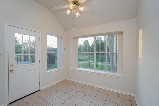 a view of an empty room with a window