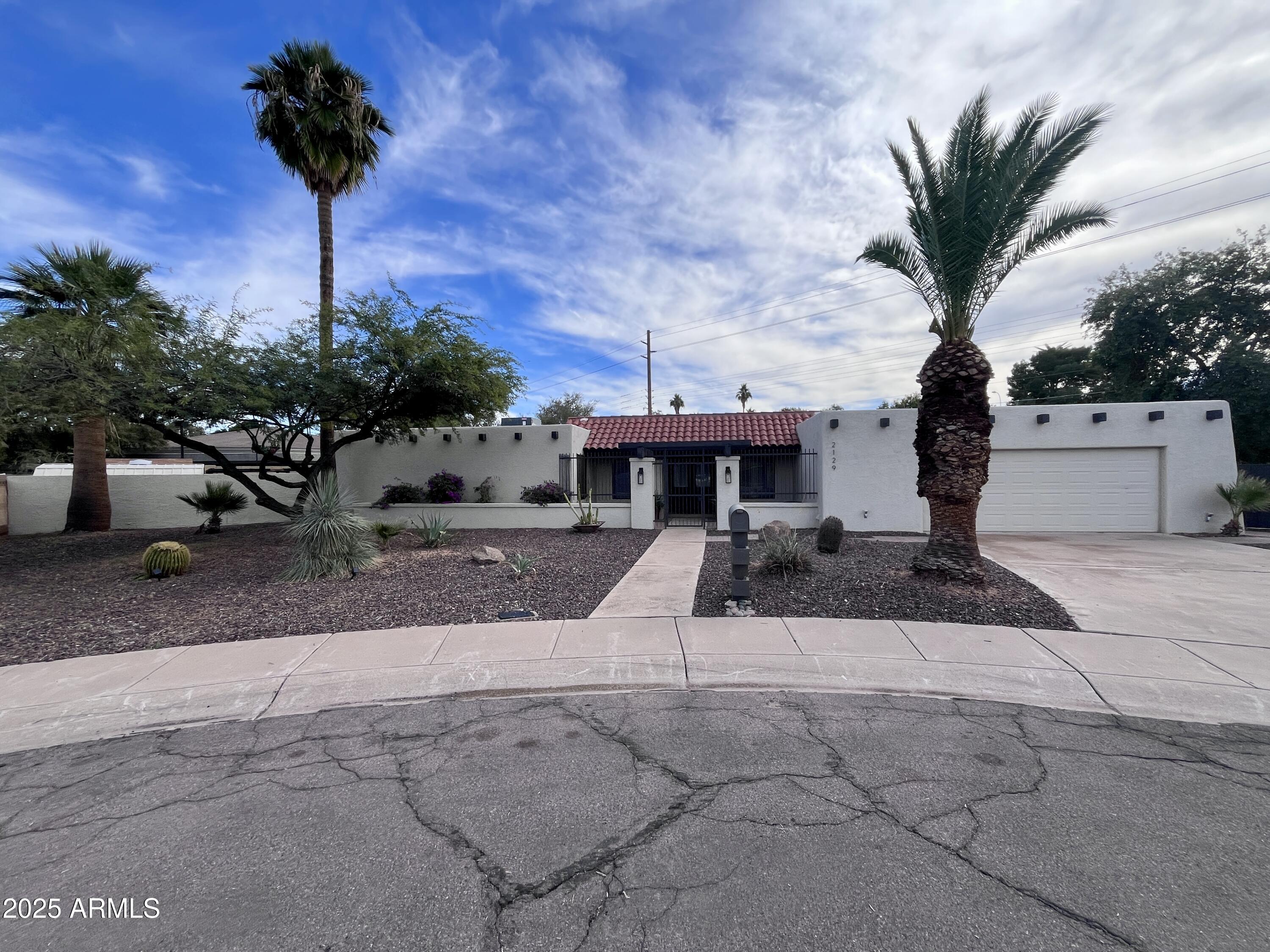 2129 East Huntington Drive Tempe, AZ 85282 - Photo 1 of 36 a front view of a house with garden
