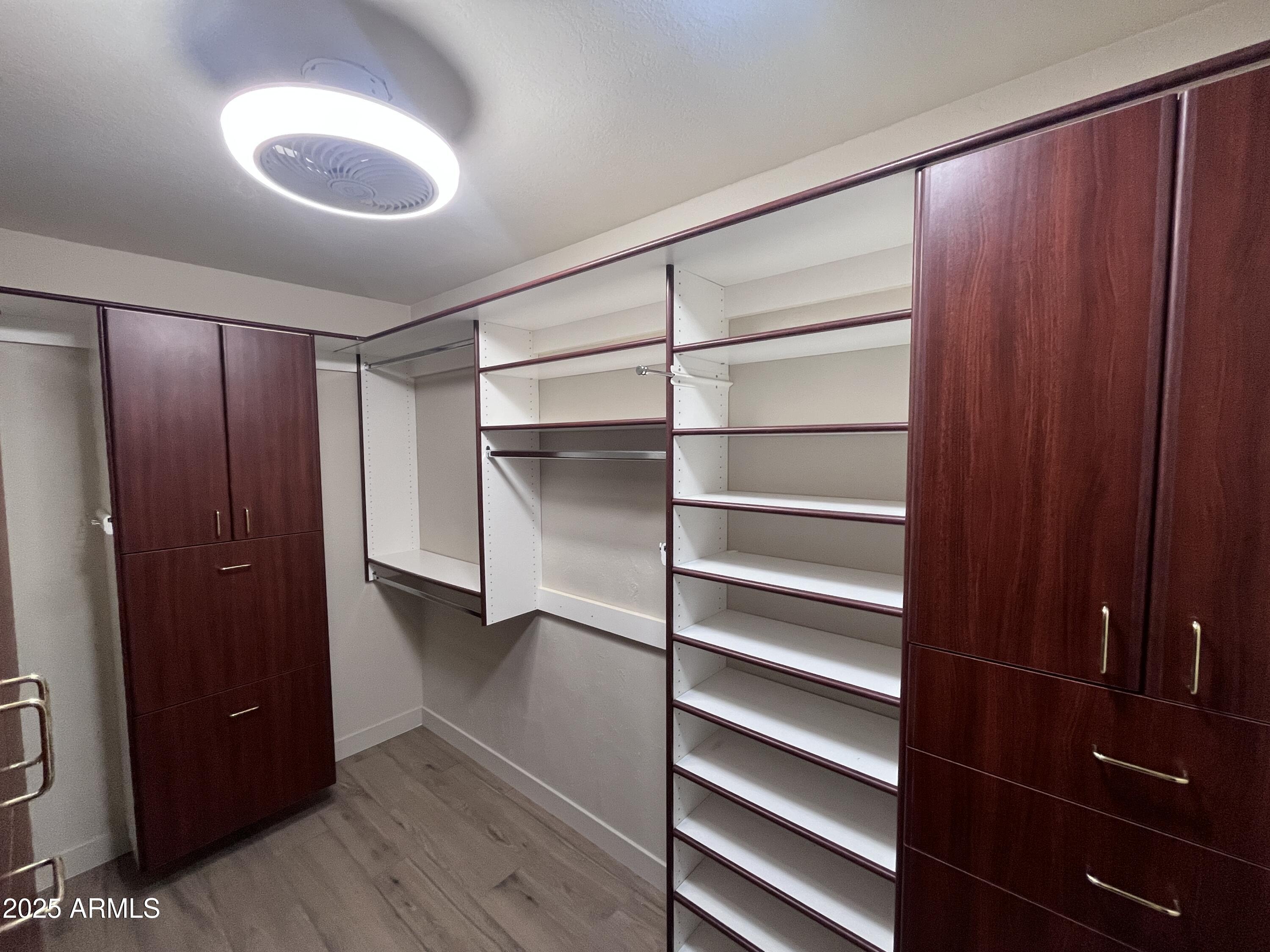 2129 East Huntington Drive Tempe, AZ 85282 - Photo 15 of 36 a view of walk in closet with empty racks