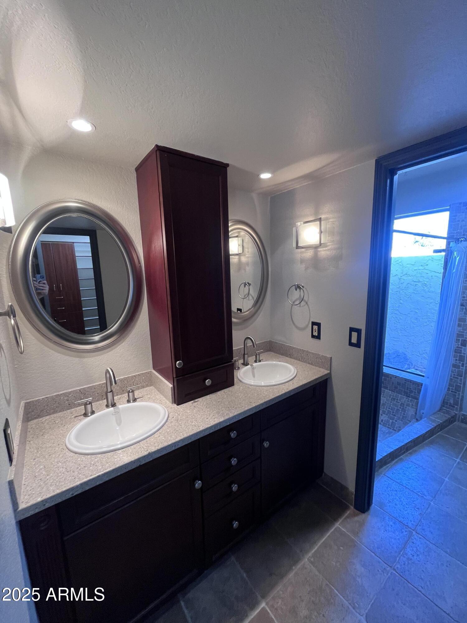 2129 East Huntington Drive Tempe, AZ 85282 - Photo 17 of 36 a bathroom with a double vanity sink and a mirror