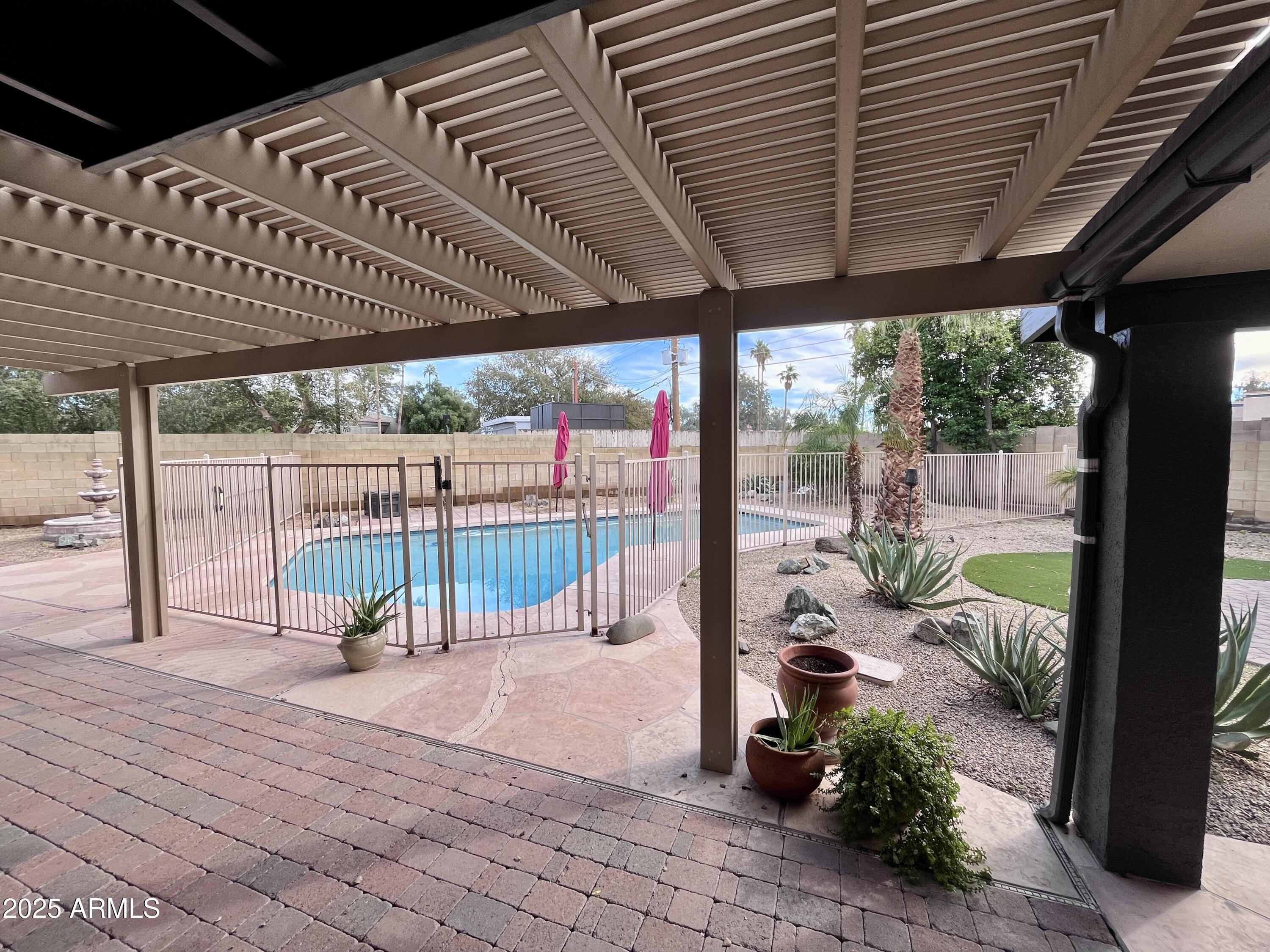2129 East Huntington Drive Tempe, AZ 85282 - Photo 24 of 36 a view of a porch with wooden floor