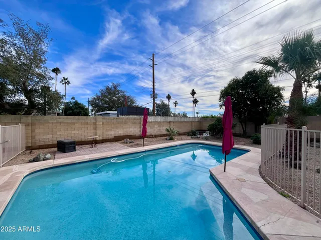 a view of a backyard with sitting area