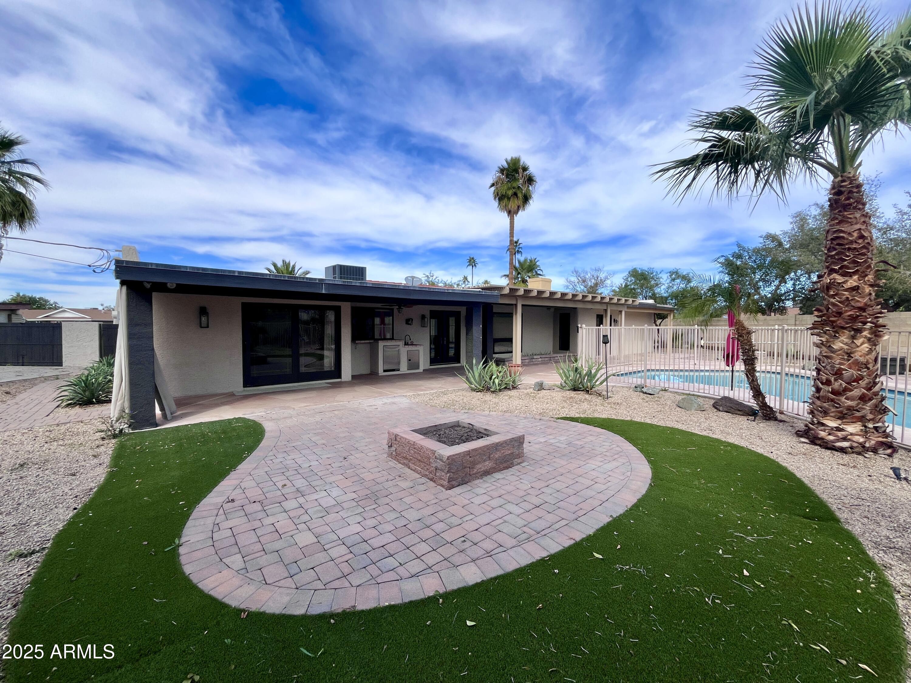 2129 East Huntington Drive Tempe, AZ 85282 - Photo 27 of 36 a front view of a house with garden