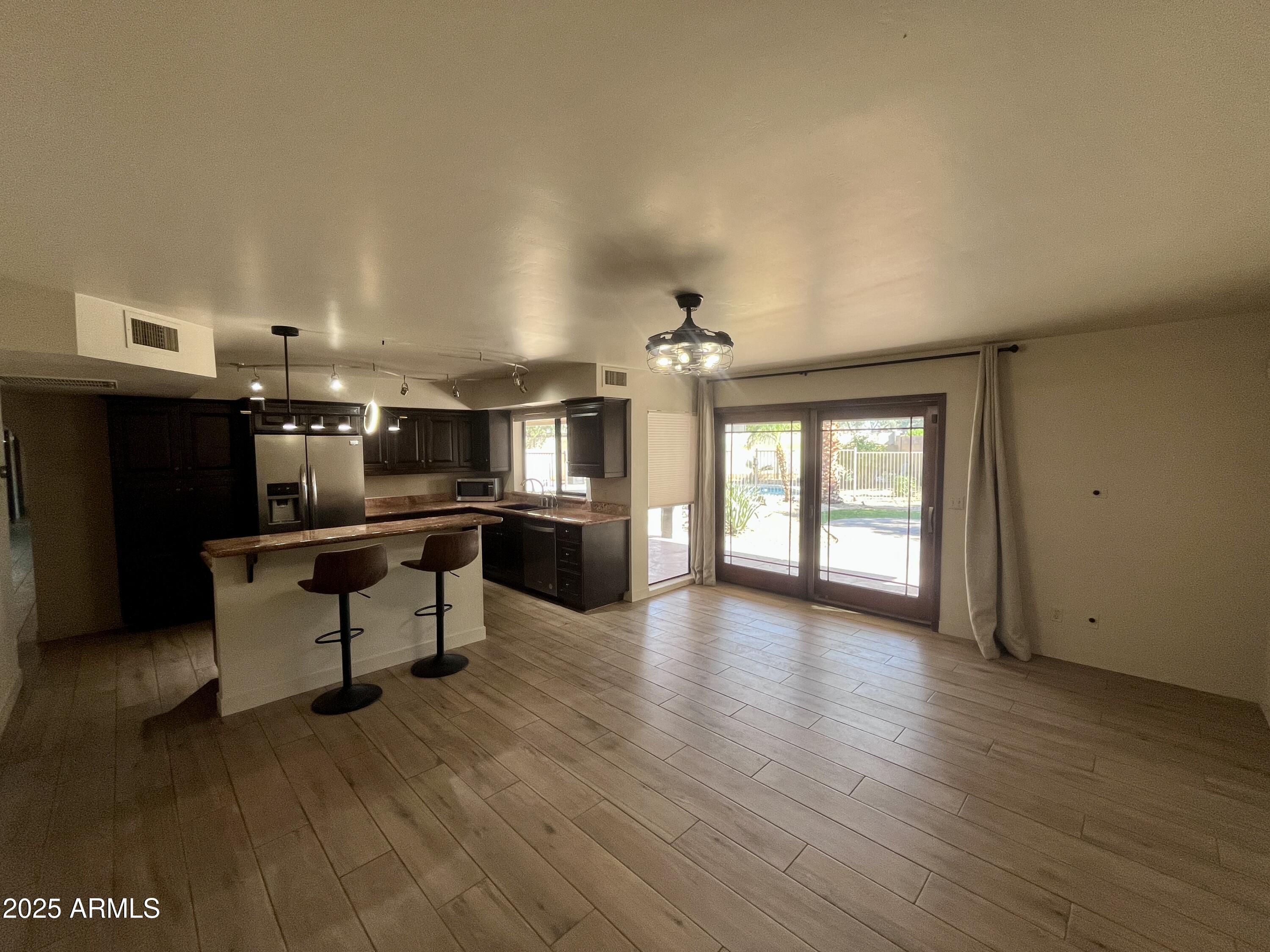 2129 East Huntington Drive Tempe, AZ 85282 - Photo 9 of 36 a living room with furniture and kitchen view