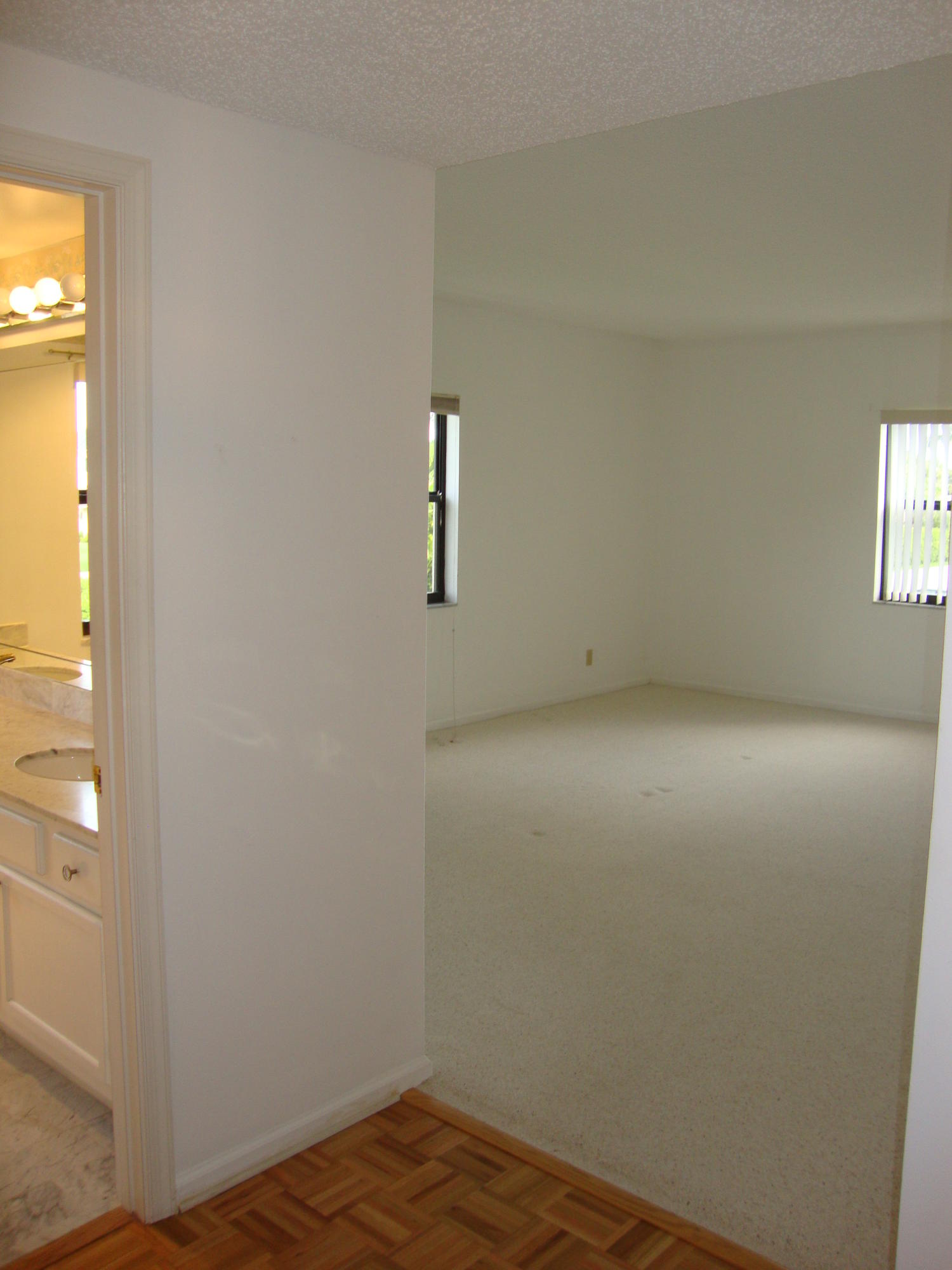 2679 South Ocean Boulevard, Unit 2B Boca Raton, FL 33432 - Photo 12 of 42 an empty room with a window