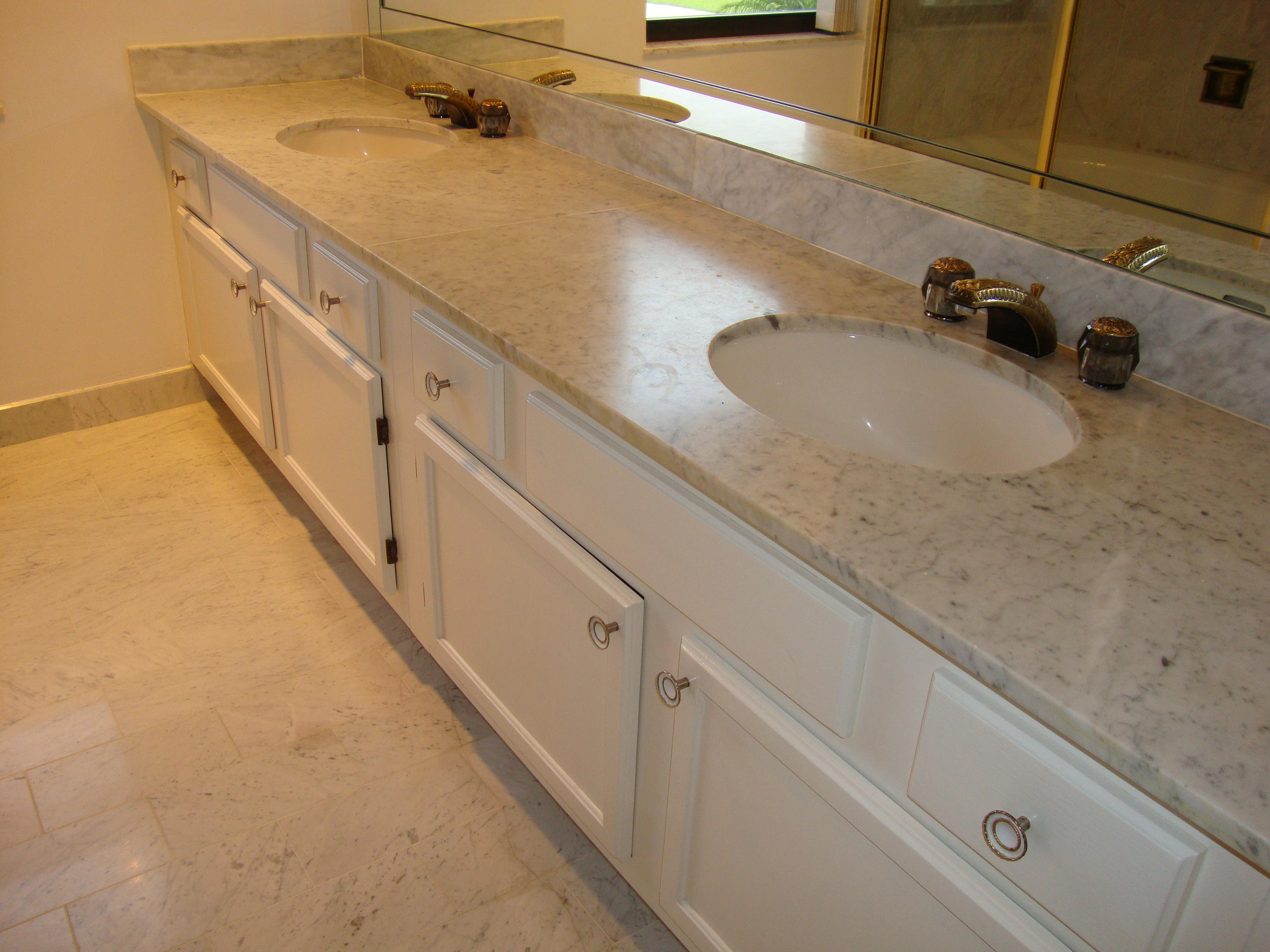 2679 South Ocean Boulevard, Unit 2B Boca Raton, FL 33432 - Photo 16 of 42 a bathroom with a sink and vanity