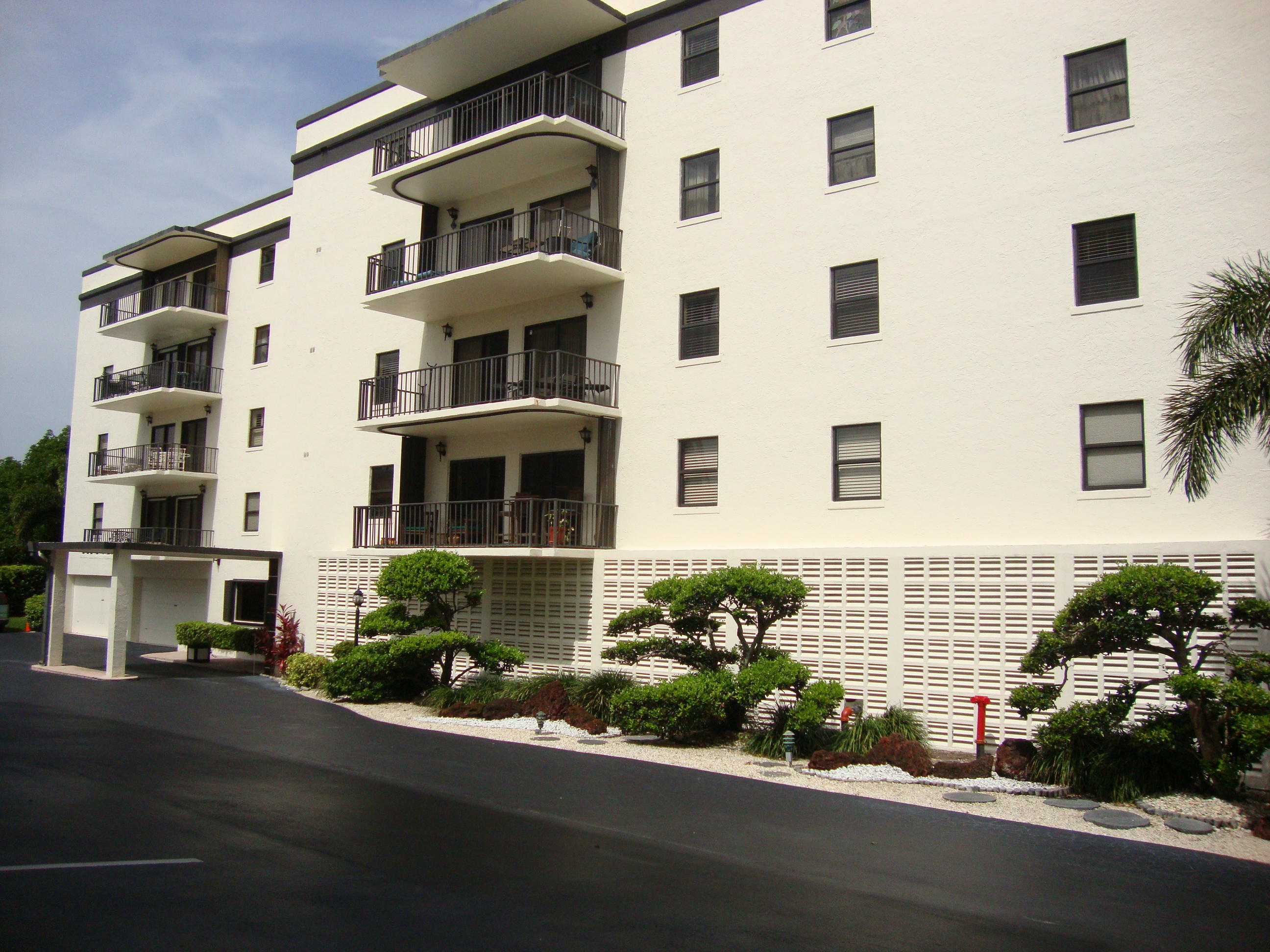 2679 South Ocean Boulevard, Unit 2B Boca Raton, FL 33432 - Photo 2 of 42 a front view of a multi story building