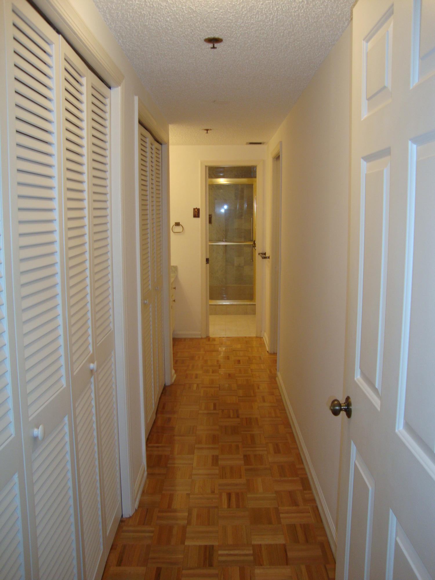 2679 South Ocean Boulevard, Unit 2B Boca Raton, FL 33432 - Photo 23 of 42 a view of a bathroom from the hallway