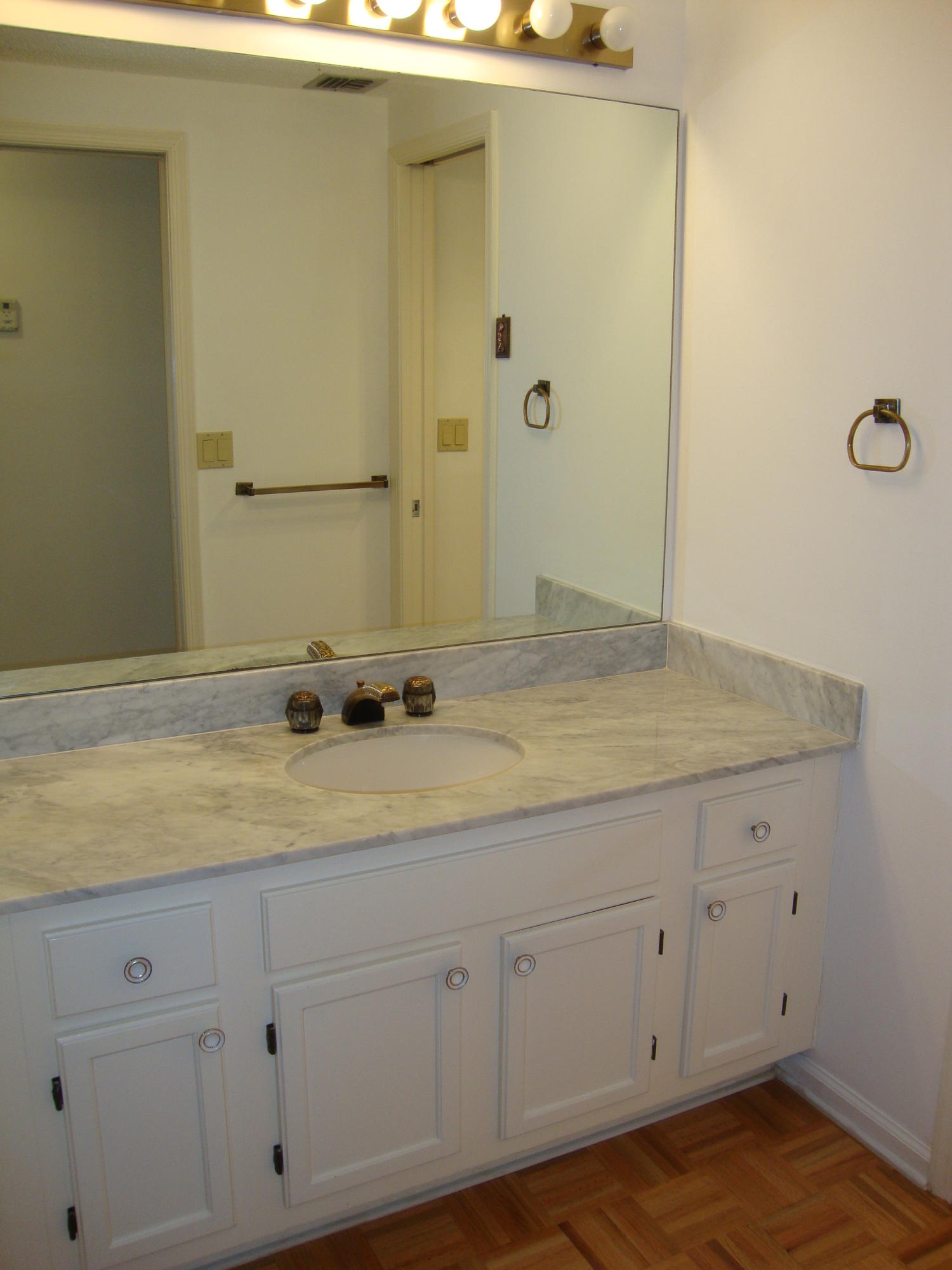 2679 South Ocean Boulevard, Unit 2B Boca Raton, FL 33432 - Photo 24 of 42 a bathroom with a sink and vanity
