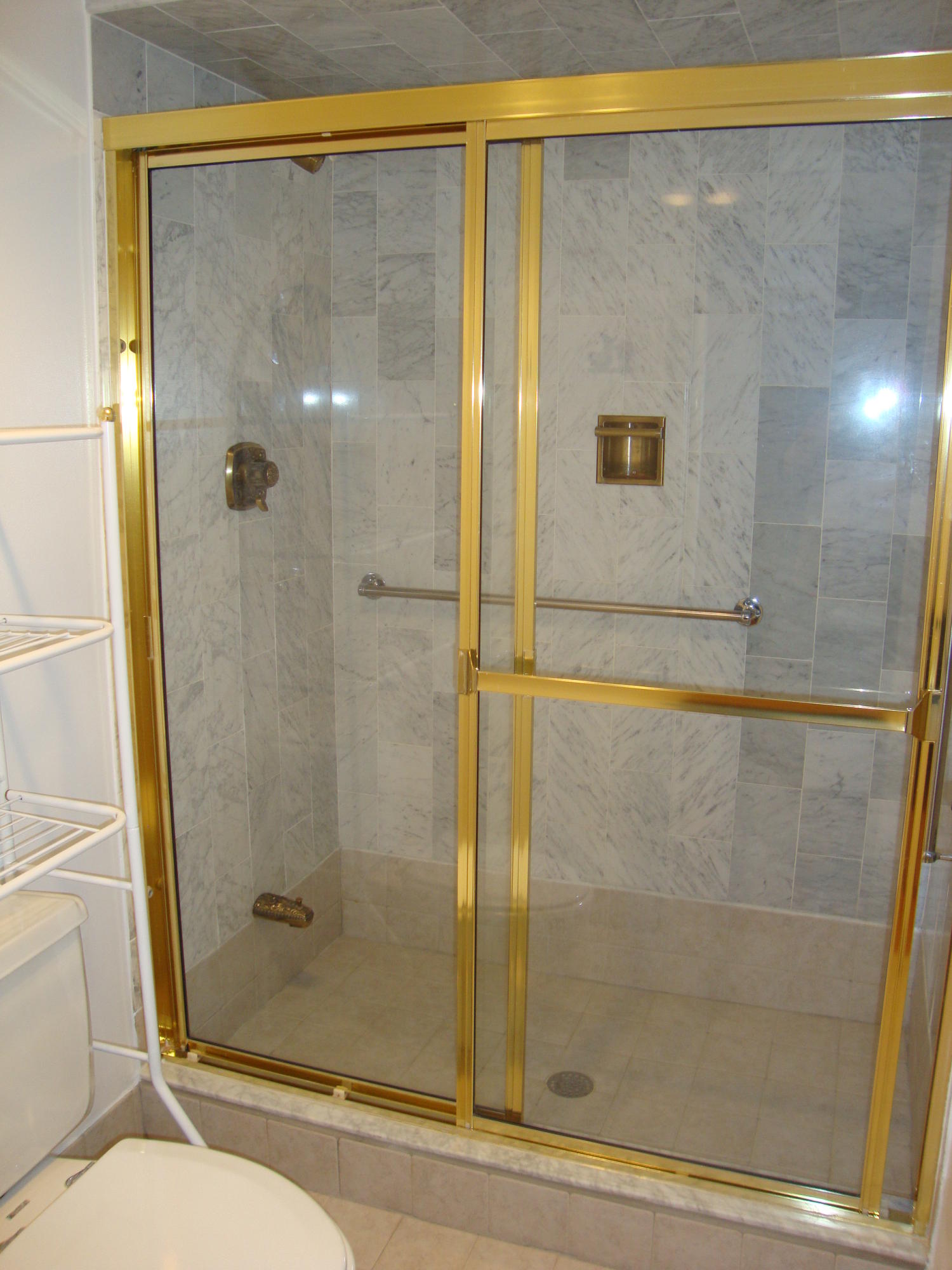 2679 South Ocean Boulevard, Unit 2B Boca Raton, FL 33432 - Photo 26 of 42 a bathroom with a shower and toilet