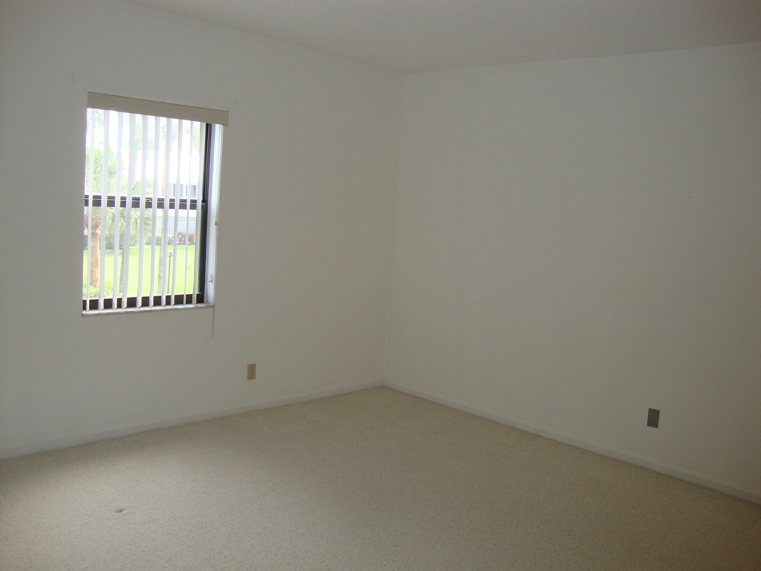 2679 South Ocean Boulevard, Unit 2B Boca Raton, FL 33432 - Photo 28 of 42 an empty room with a window