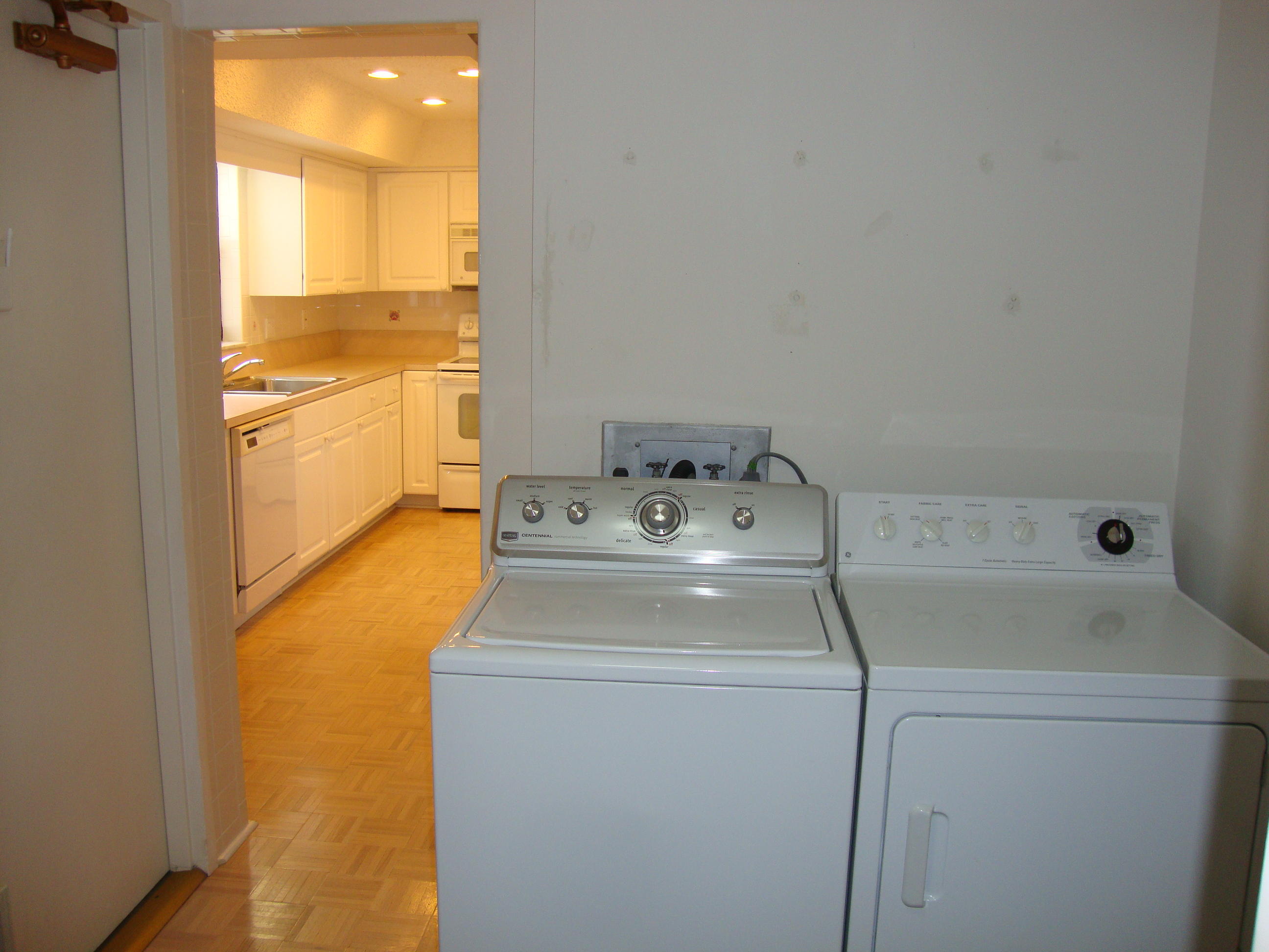 2679 South Ocean Boulevard, Unit 2B Boca Raton, FL 33432 - Photo 32 of 42 a utility room with dryer and washer