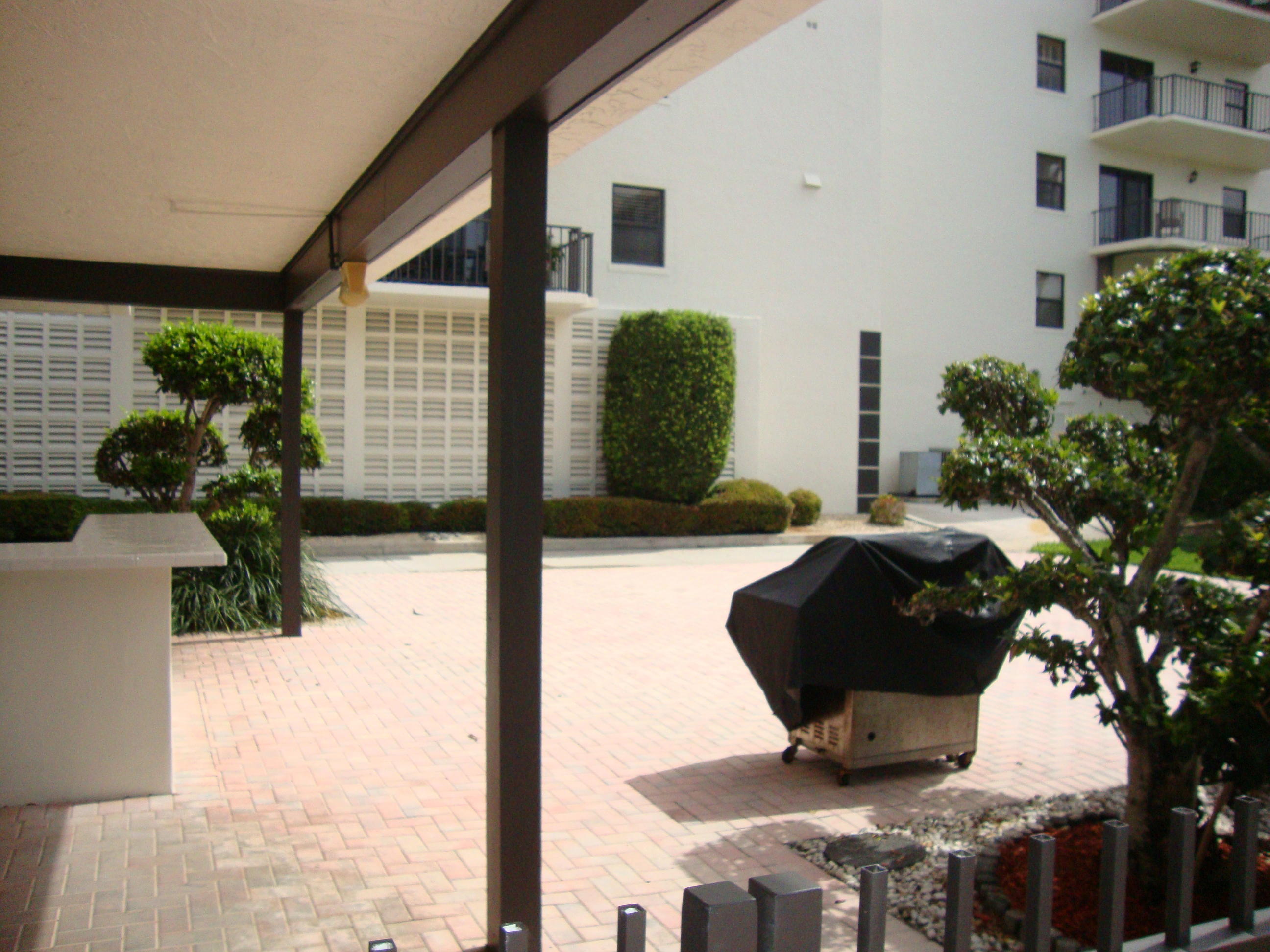 2679 South Ocean Boulevard, Unit 2B Boca Raton, FL 33432 - Photo 37 of 42 a vase of flowers sitting on a table