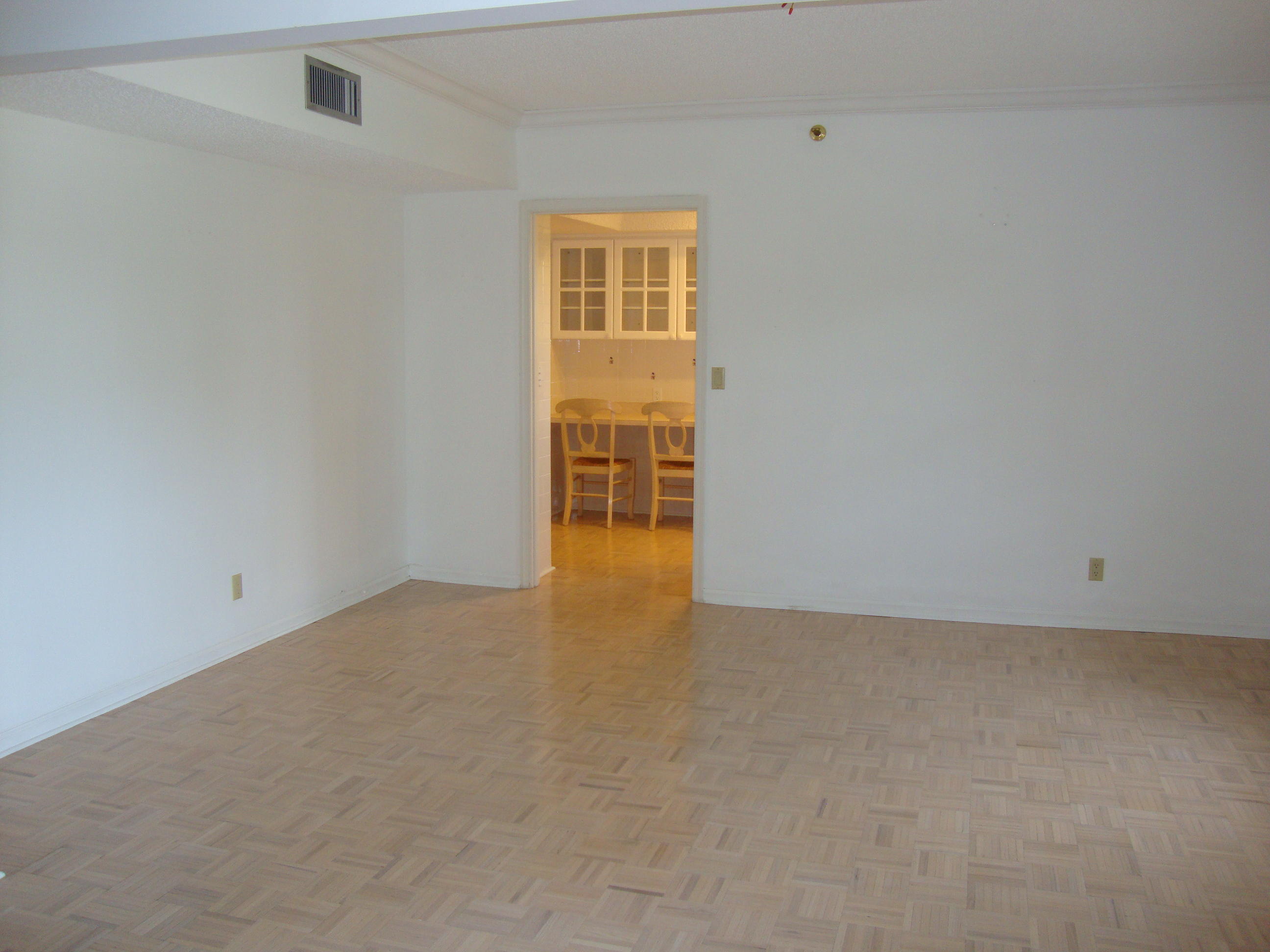 2679 South Ocean Boulevard, Unit 2B Boca Raton, FL 33432 - Photo 8 of 42 an empty room with windows