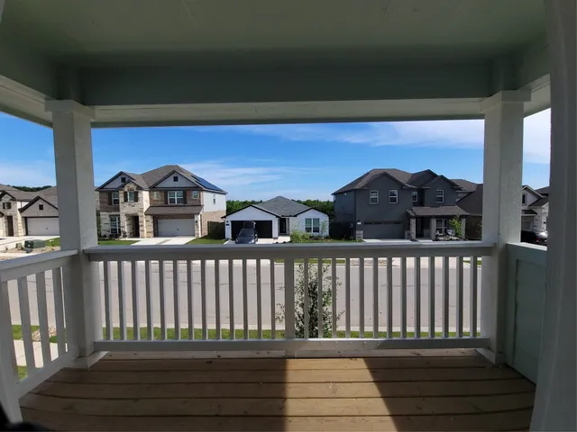 a view of a street from a balcony