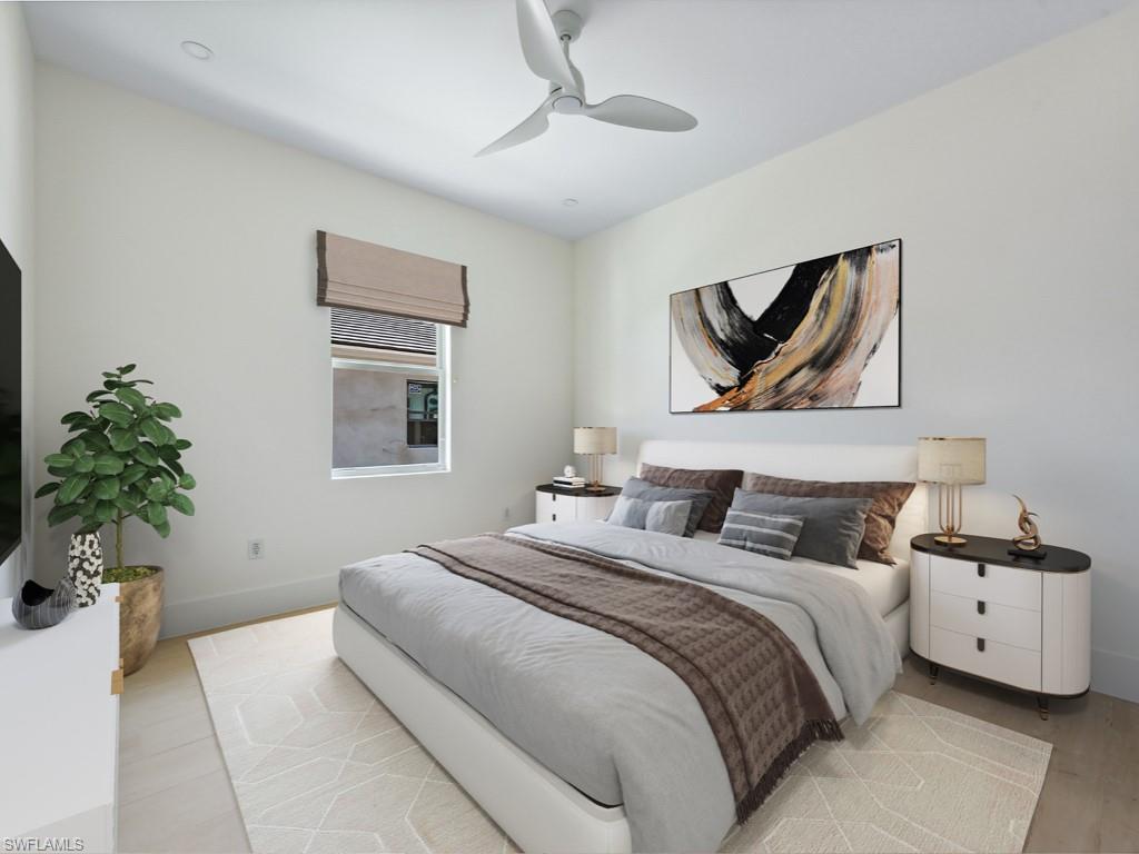 Undisclosed Address Naples, FL 34110 - Photo 12 of 27 a bedroom with a bed and a potted plant