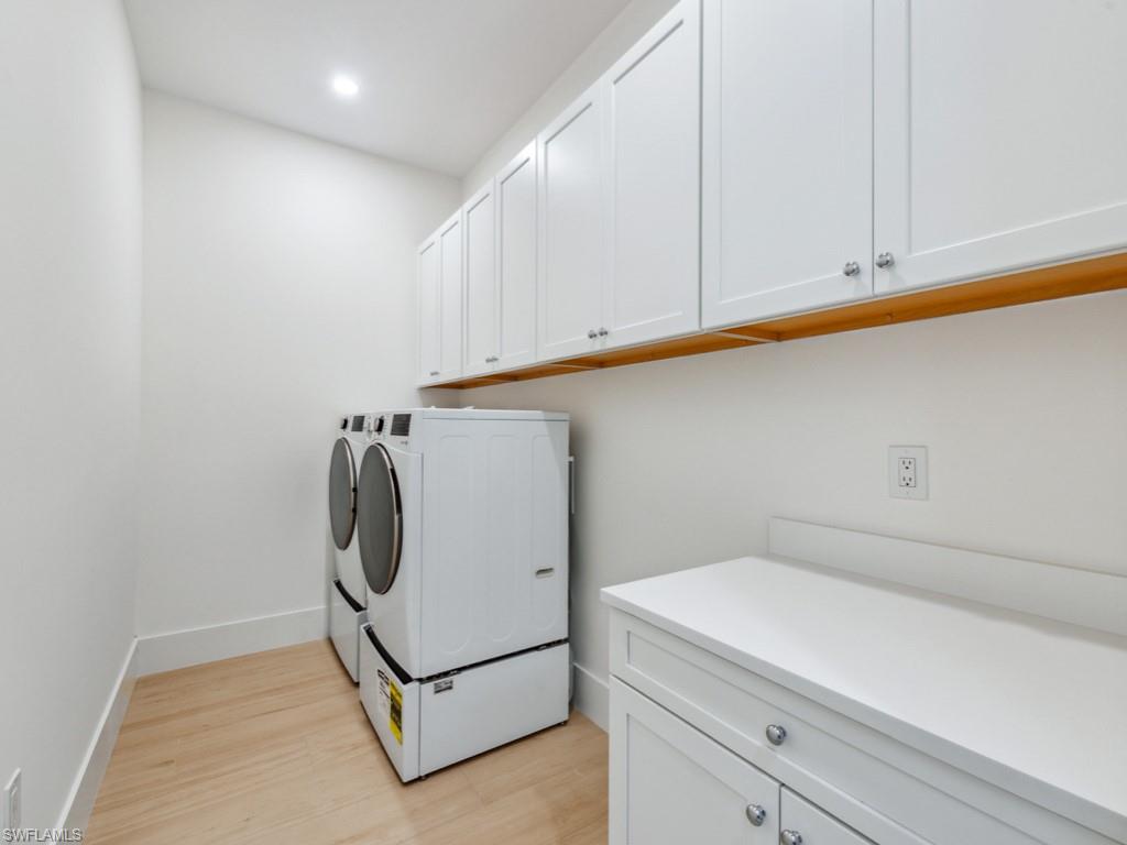 Undisclosed Address Naples, FL 34110 - Photo 18 of 27 a utility room with dryer and washer