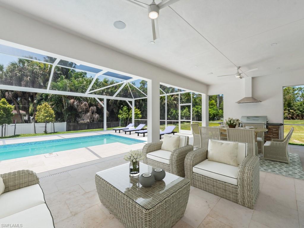 Undisclosed Address Naples, FL 34110 - Photo 19 of 27 a living room with furniture and garden view
