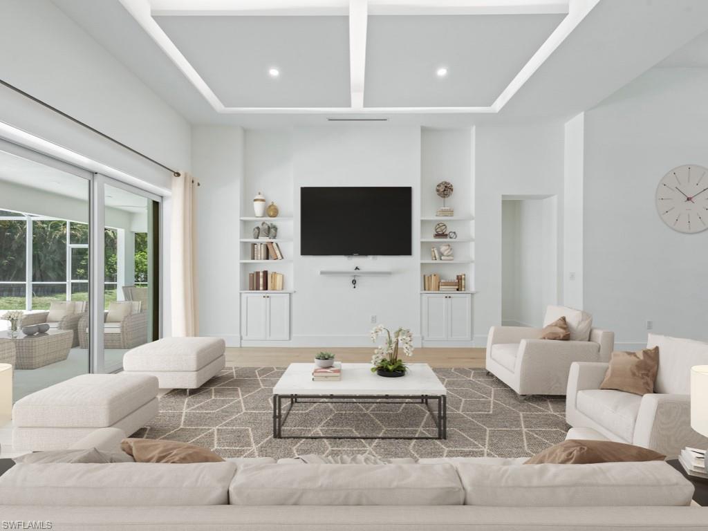 Undisclosed Address Naples, FL 34110 - Photo 4 of 27 a living room with furniture a flat screen tv and a large window