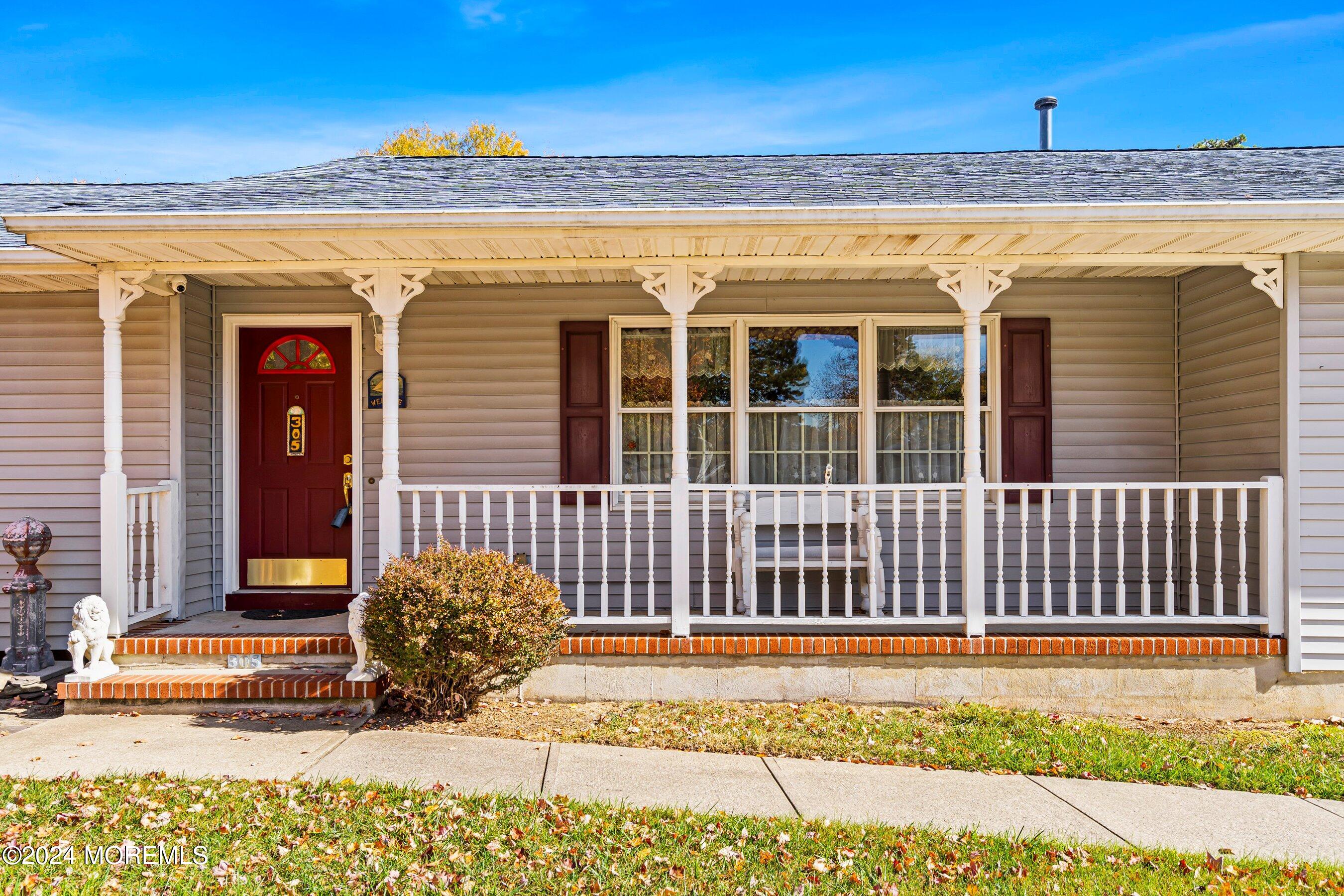 305 Bayside E Parkway Forked River, NJ 08731 - Photo 11 of 39 a view of a brick house with a large window