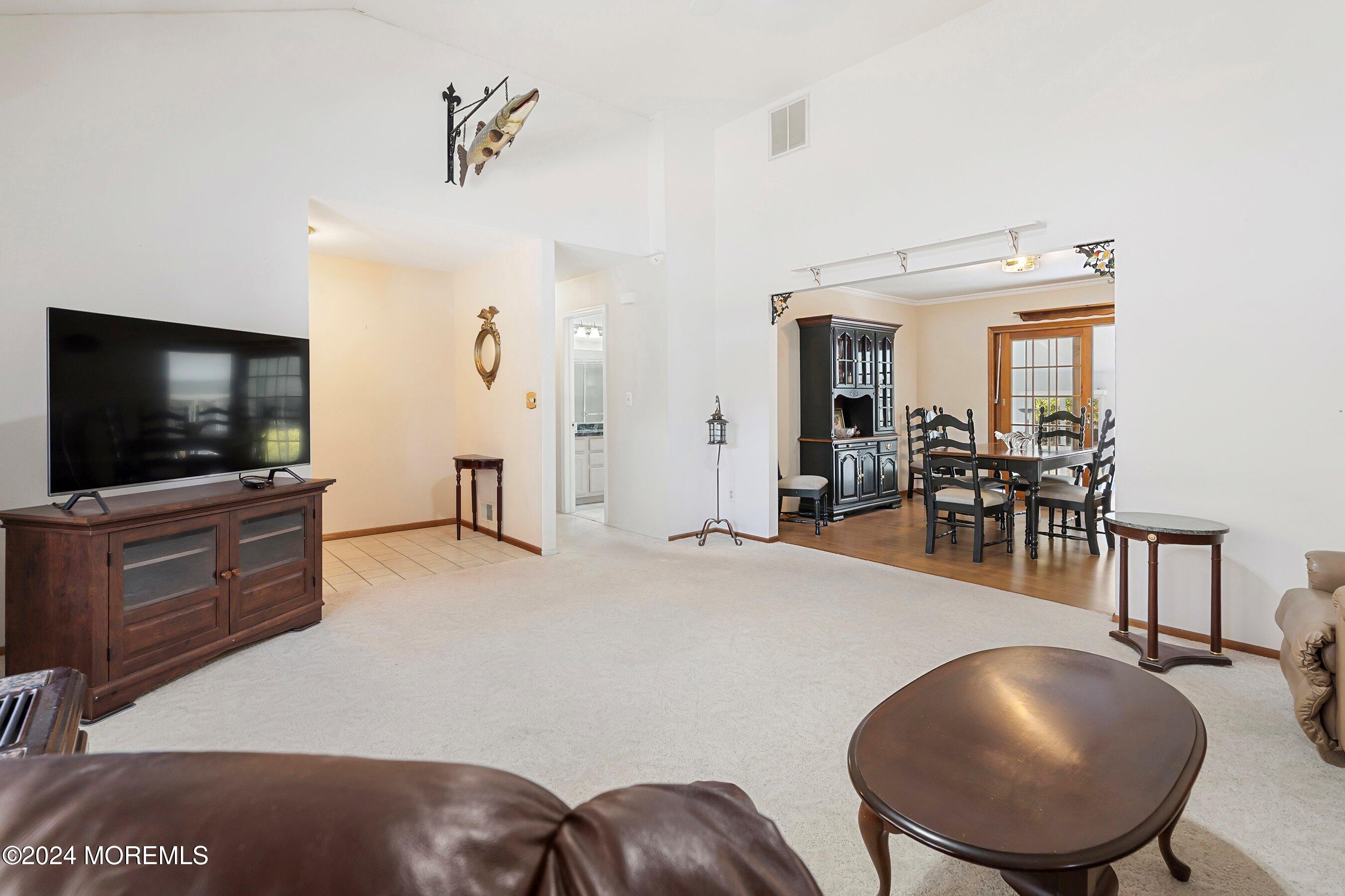 305 Bayside E Parkway Forked River, NJ 08731 - Photo 15 of 39 a living room with furniture and a flat screen tv