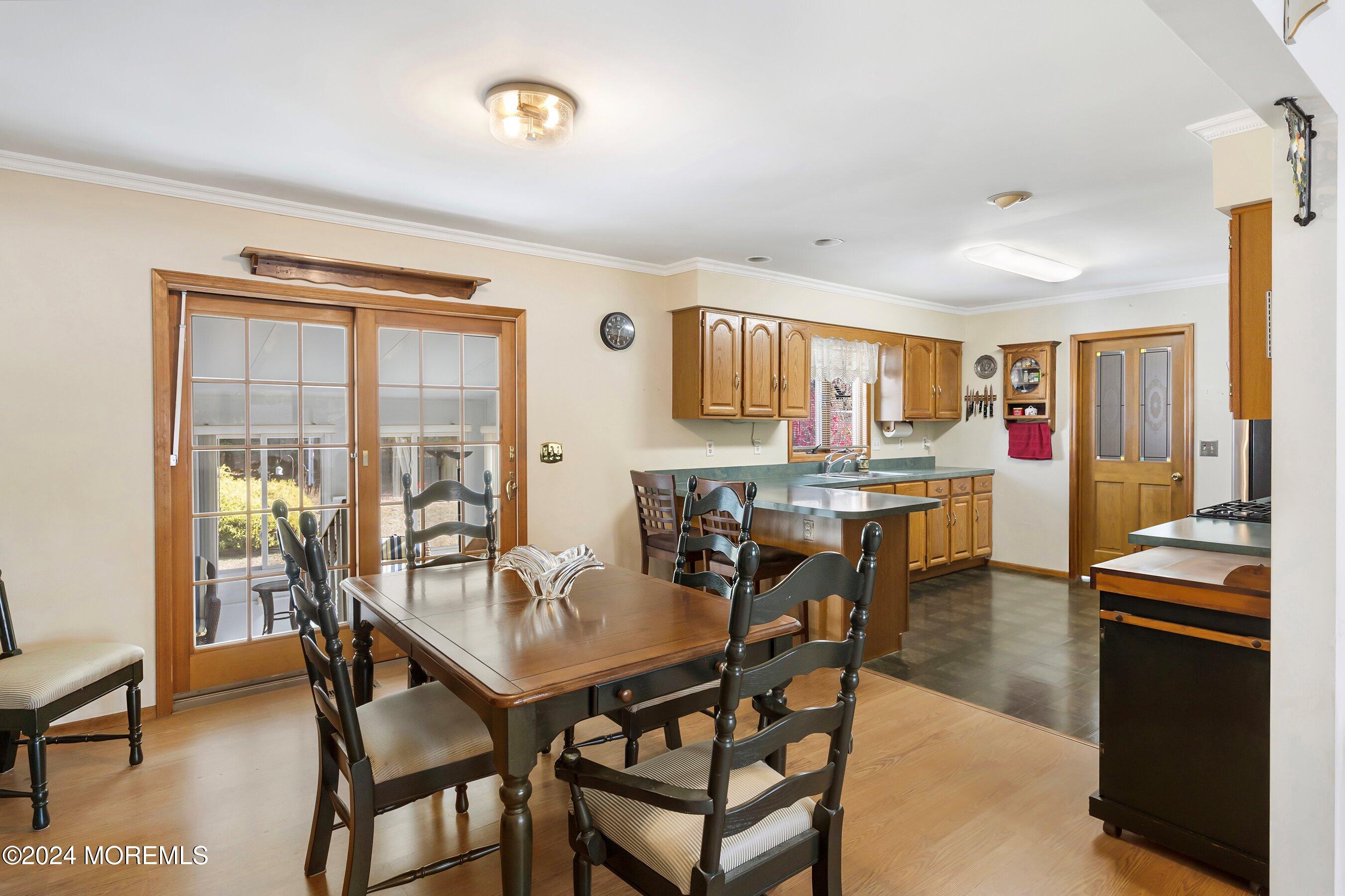 305 Bayside E Parkway Forked River, NJ 08731 - Photo 18 of 39 a view of a dining room with furniture and a kitchen
