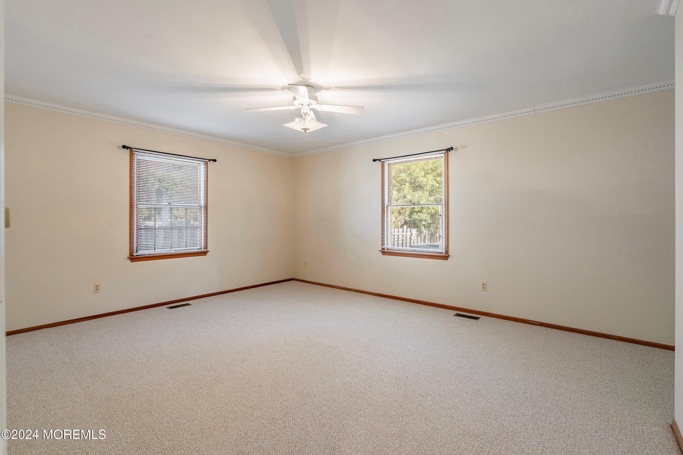305 Bayside E Parkway Forked River, NJ 08731 - Photo 29 of 39 an empty room with windows and fan