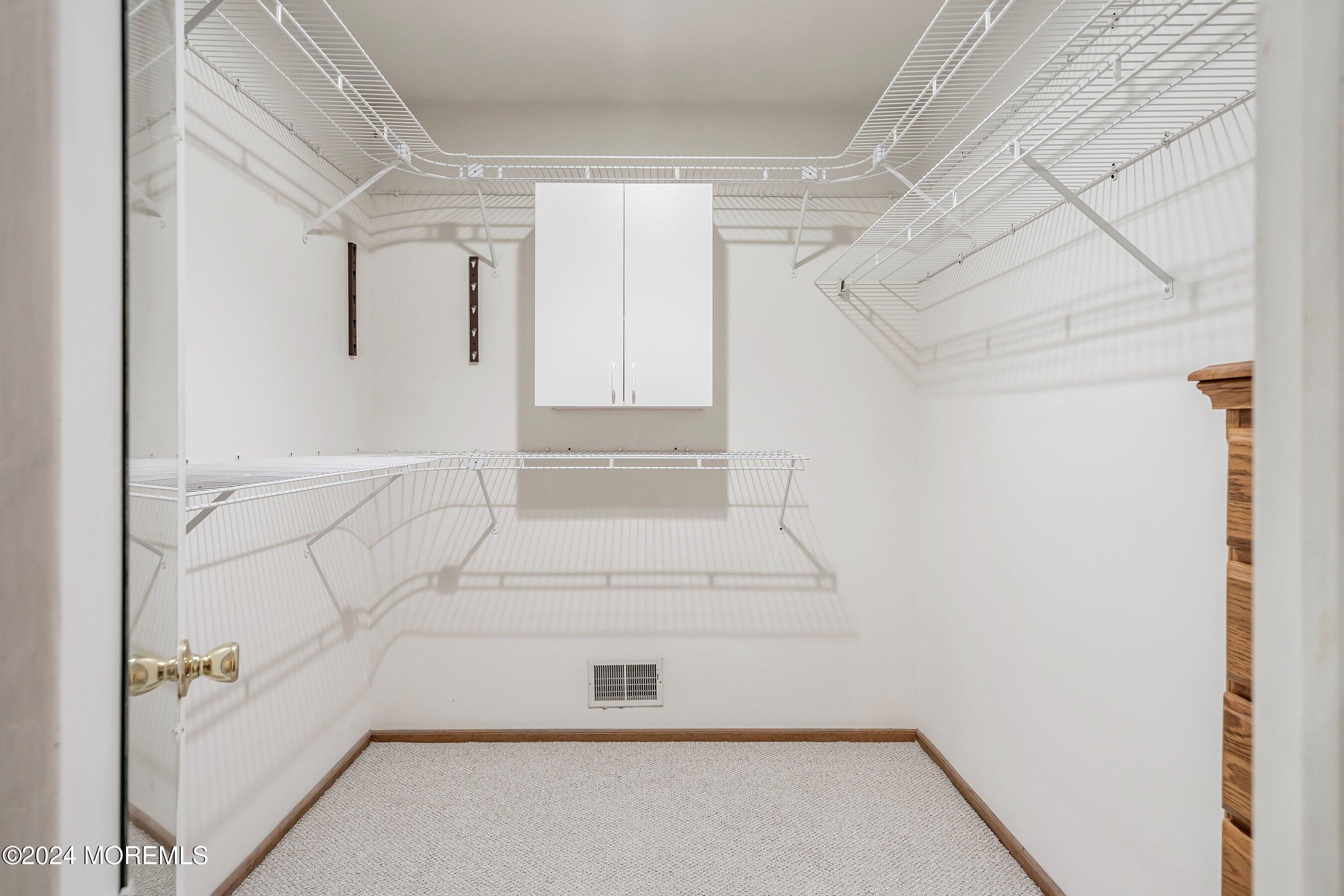 305 Bayside E Parkway Forked River, NJ 08731 - Photo 31 of 39 a view of walk in closet with empty racks