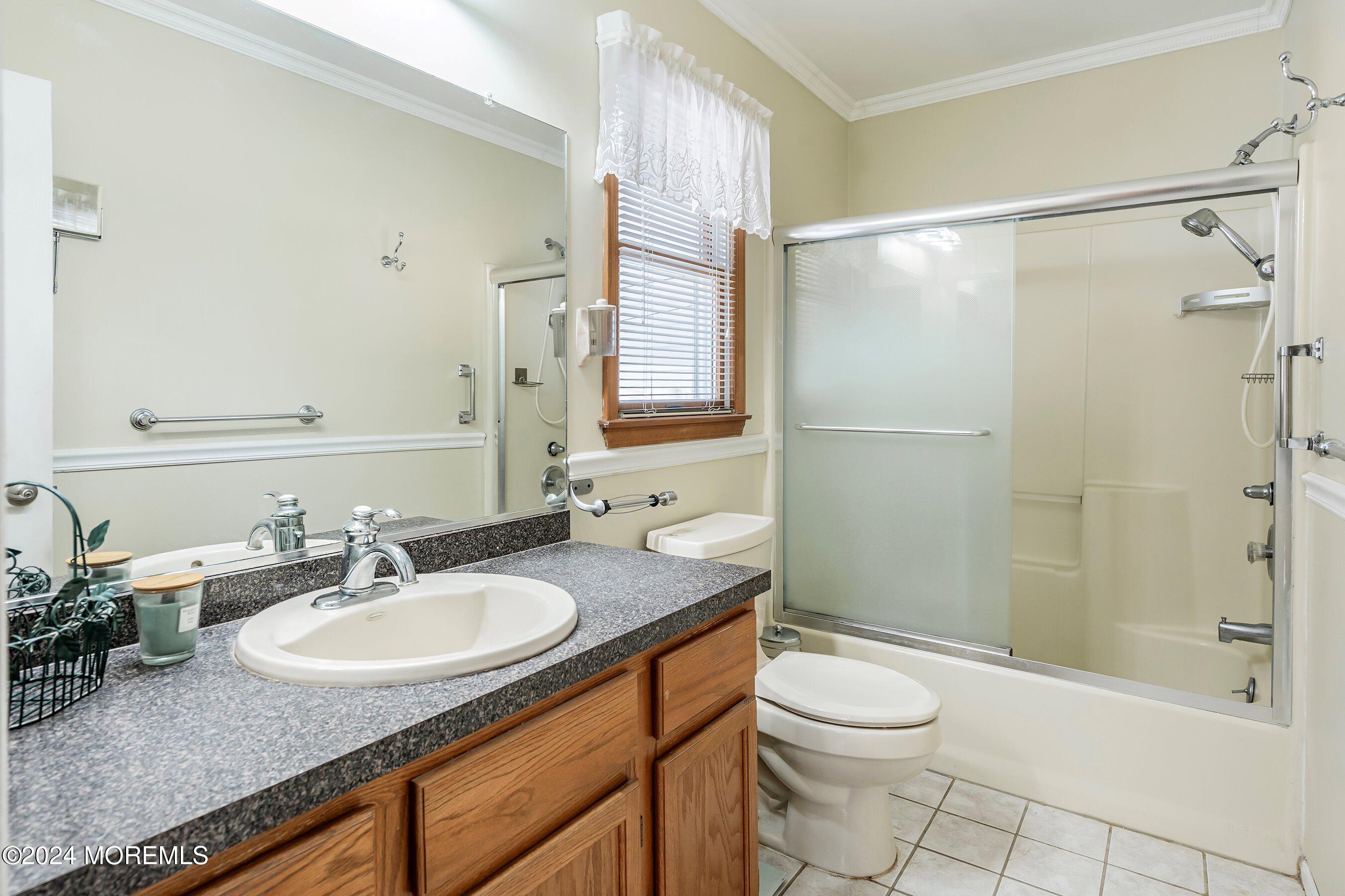 305 Bayside E Parkway Forked River, NJ 08731 - Photo 32 of 39 a bathroom with a granite countertop sink toilet and shower