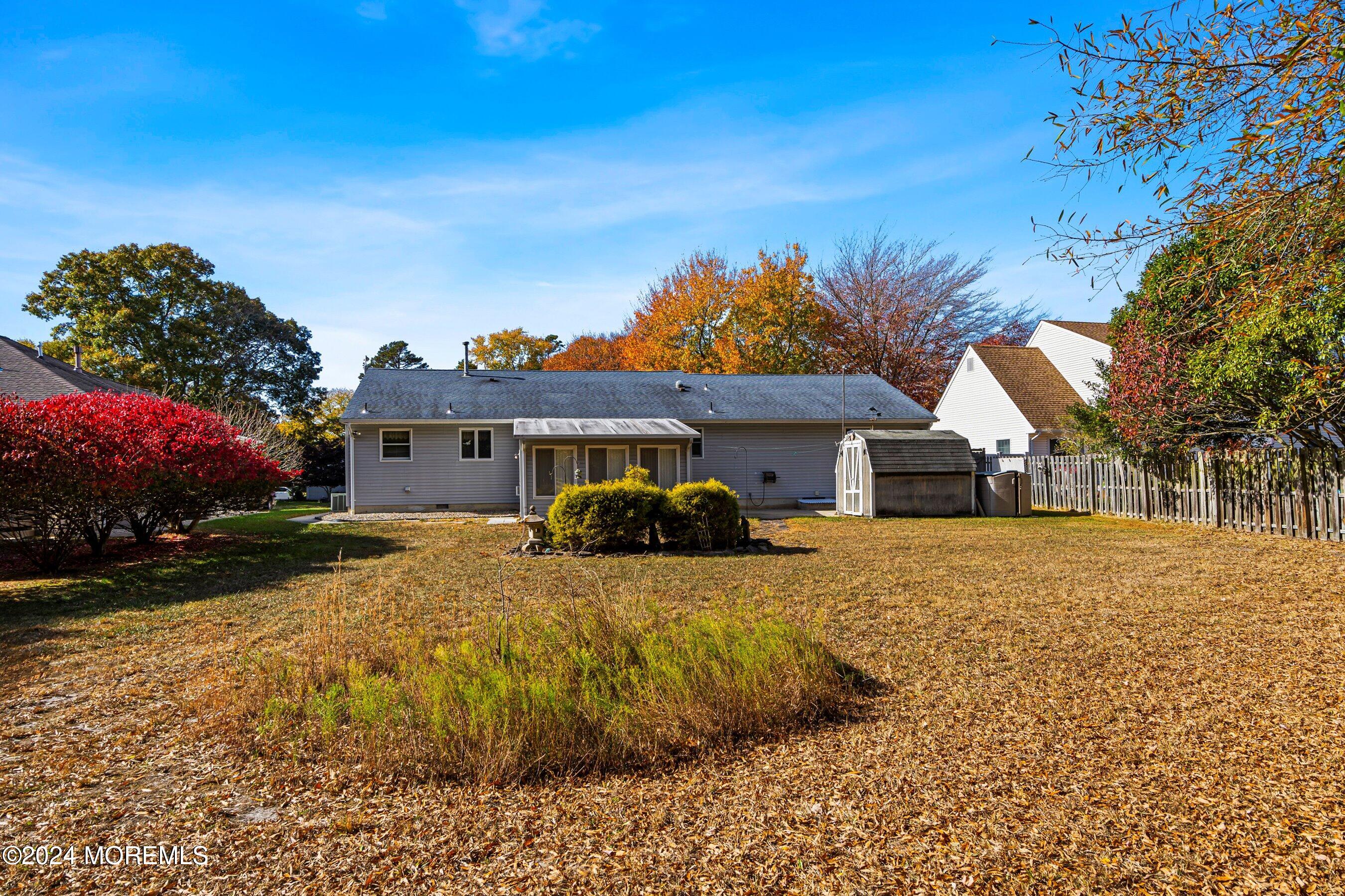305 Bayside E Parkway Forked River, NJ 08731 - Photo 38 of 39 a front view of house with yard and trees in the background