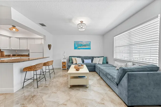 a bedroom with furniture and window