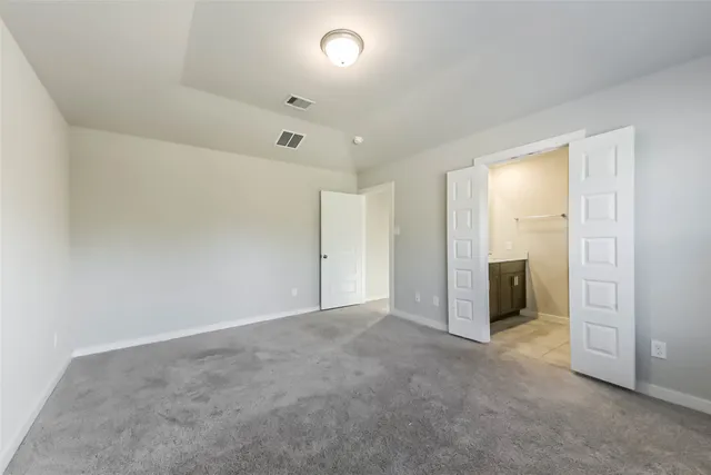 an empty room with a bathroom